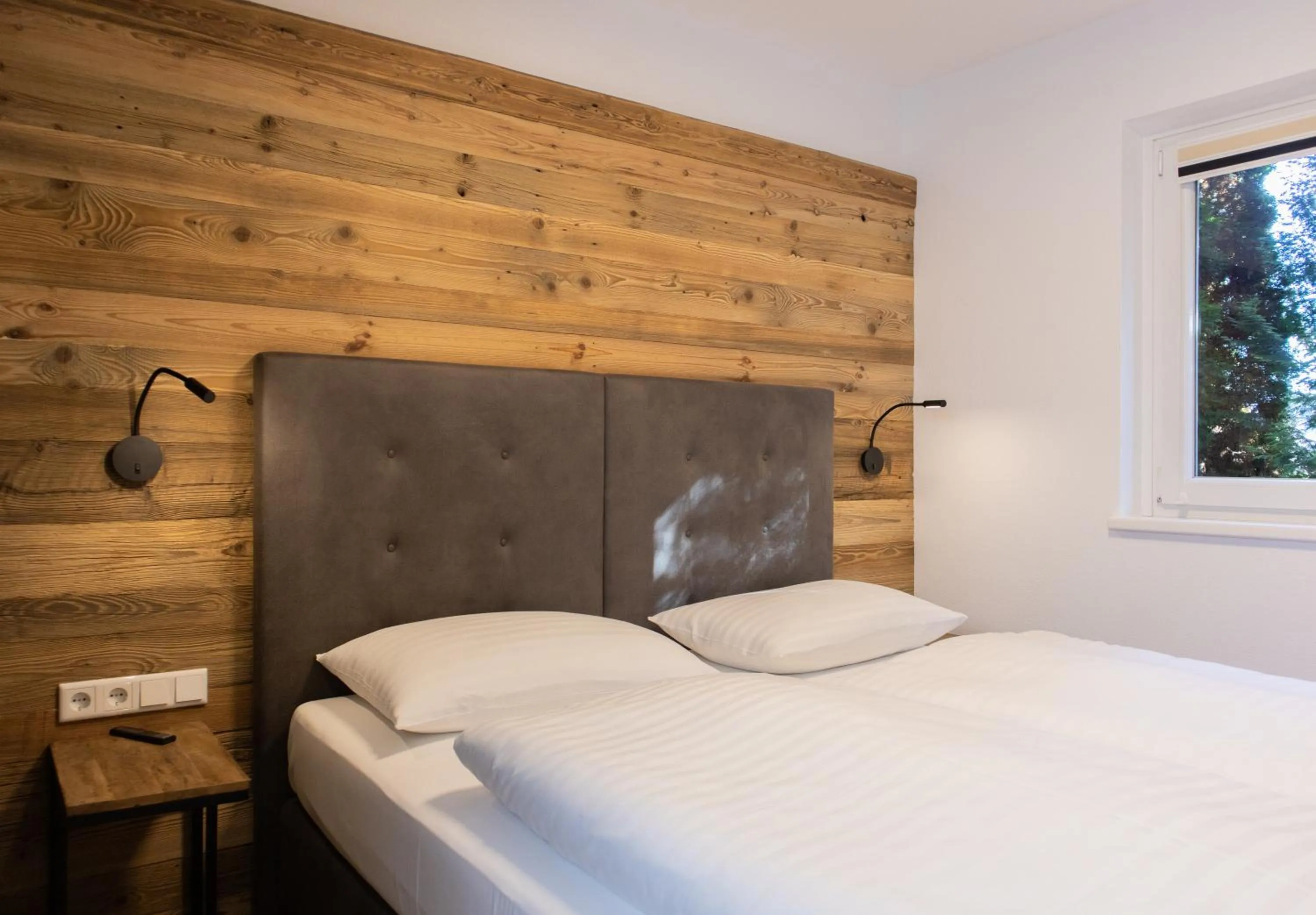 Bed in AvenidA Style Appartements by Alpin Rentals