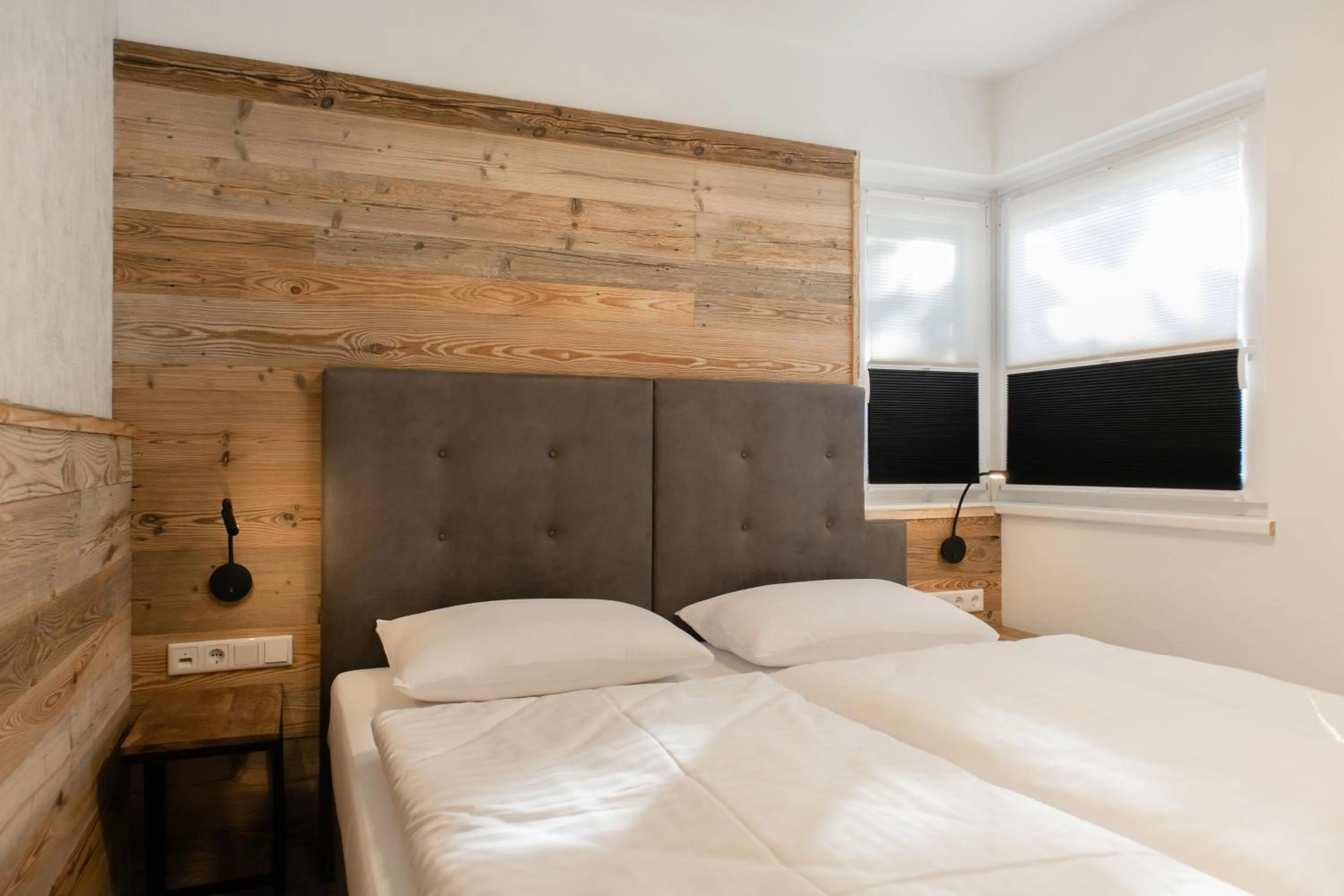 Bed in AvenidA Style Appartements by Alpin Rentals