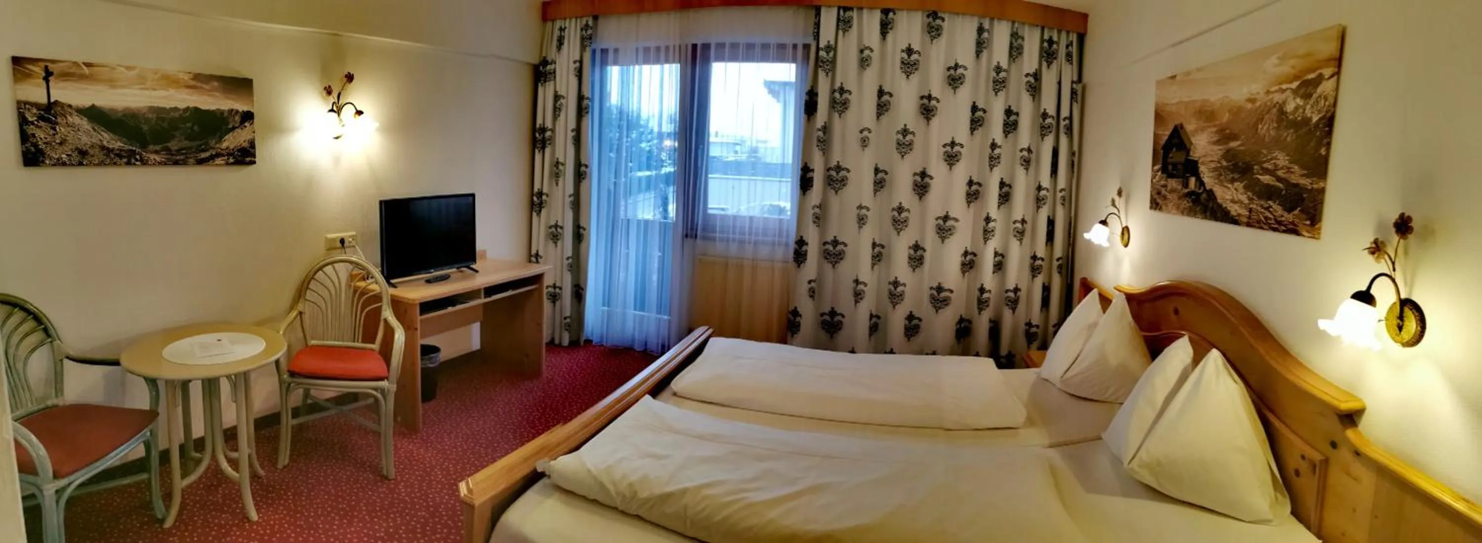 Photo of the whole room, Bed in Hotel Landhaus Zillertal