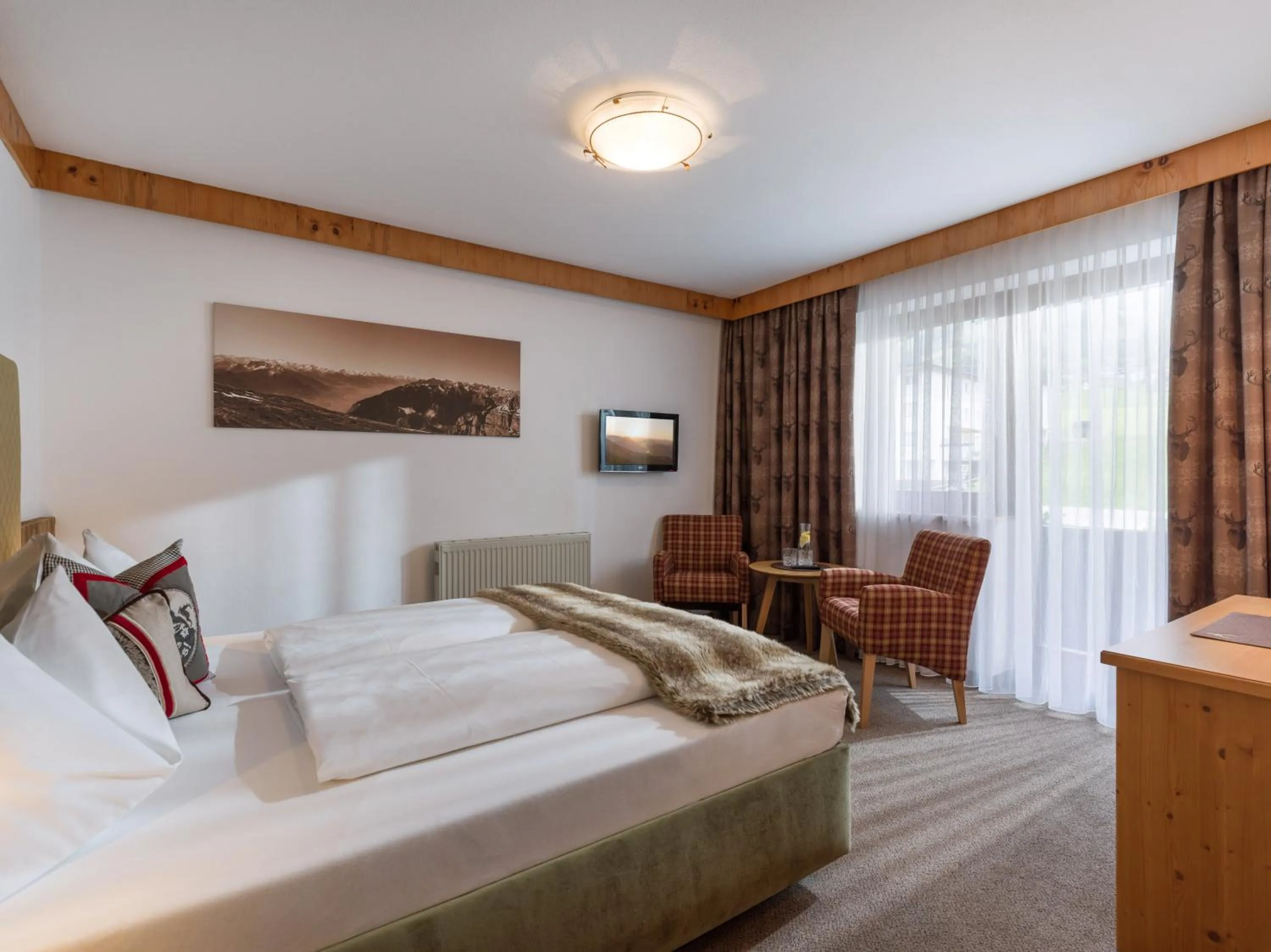 Photo of the whole room, Bed in Hotel Landhaus Zillertal