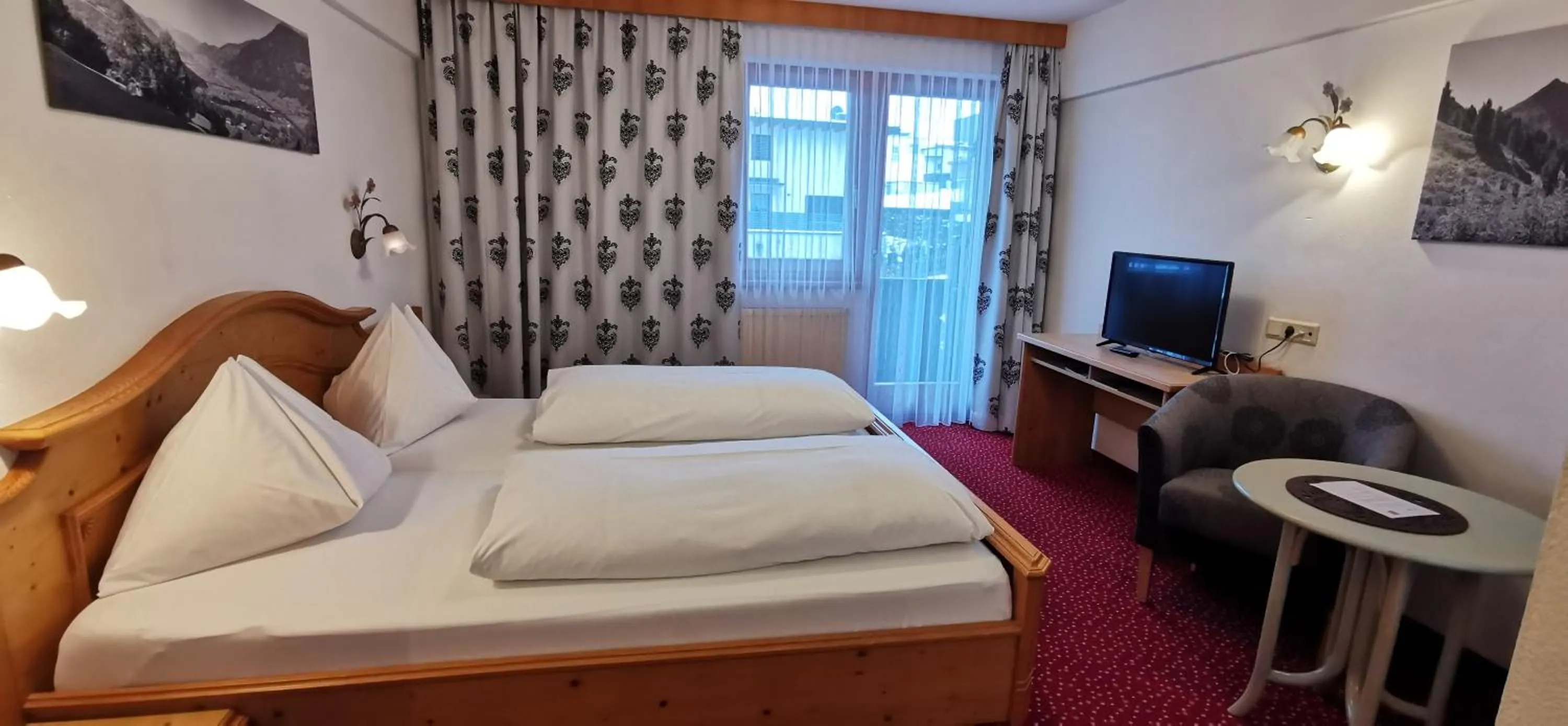 Photo of the whole room, Bed in Hotel Landhaus Zillertal