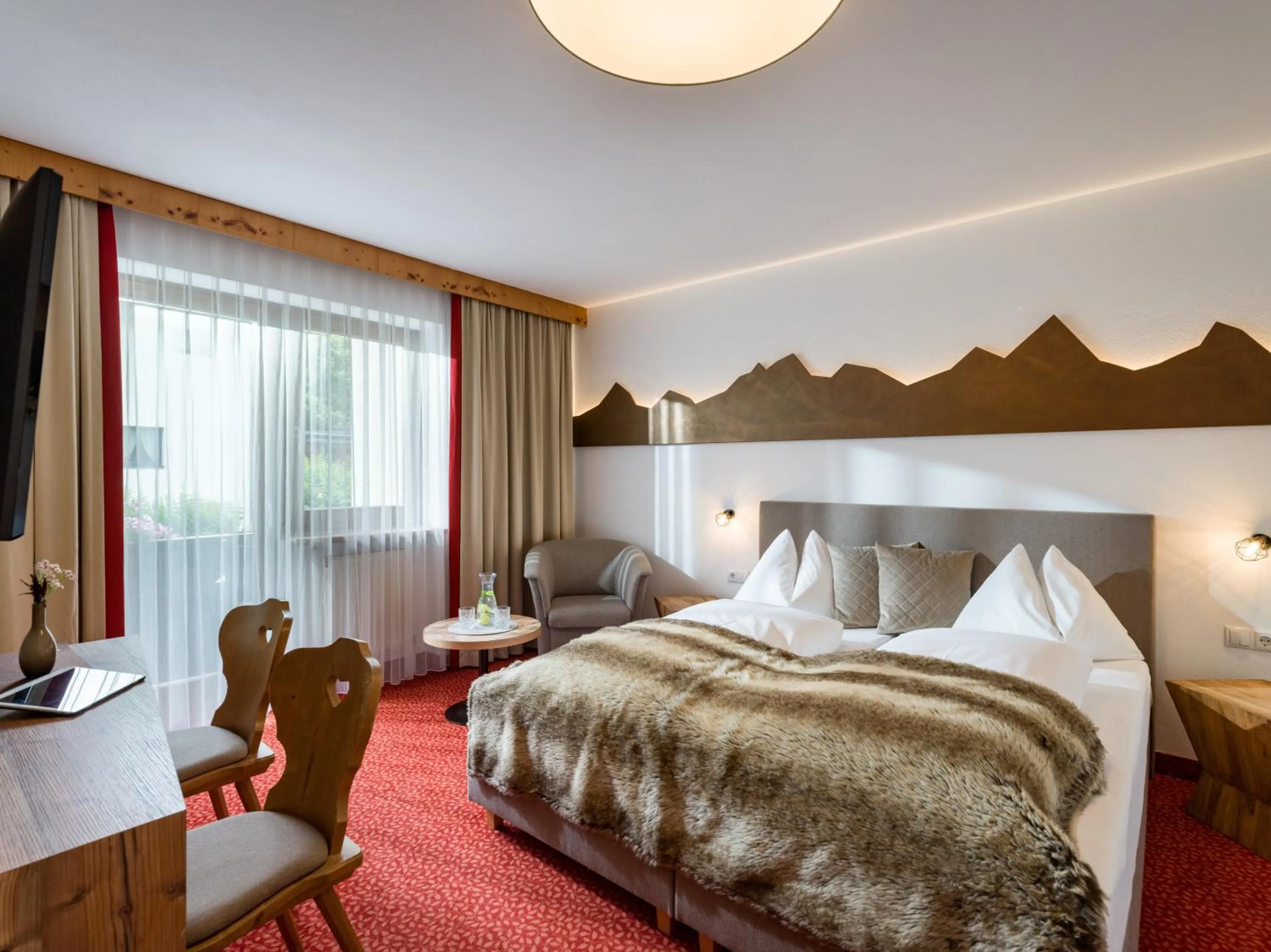 Photo of the whole room, Bed in Hotel Landhaus Zillertal