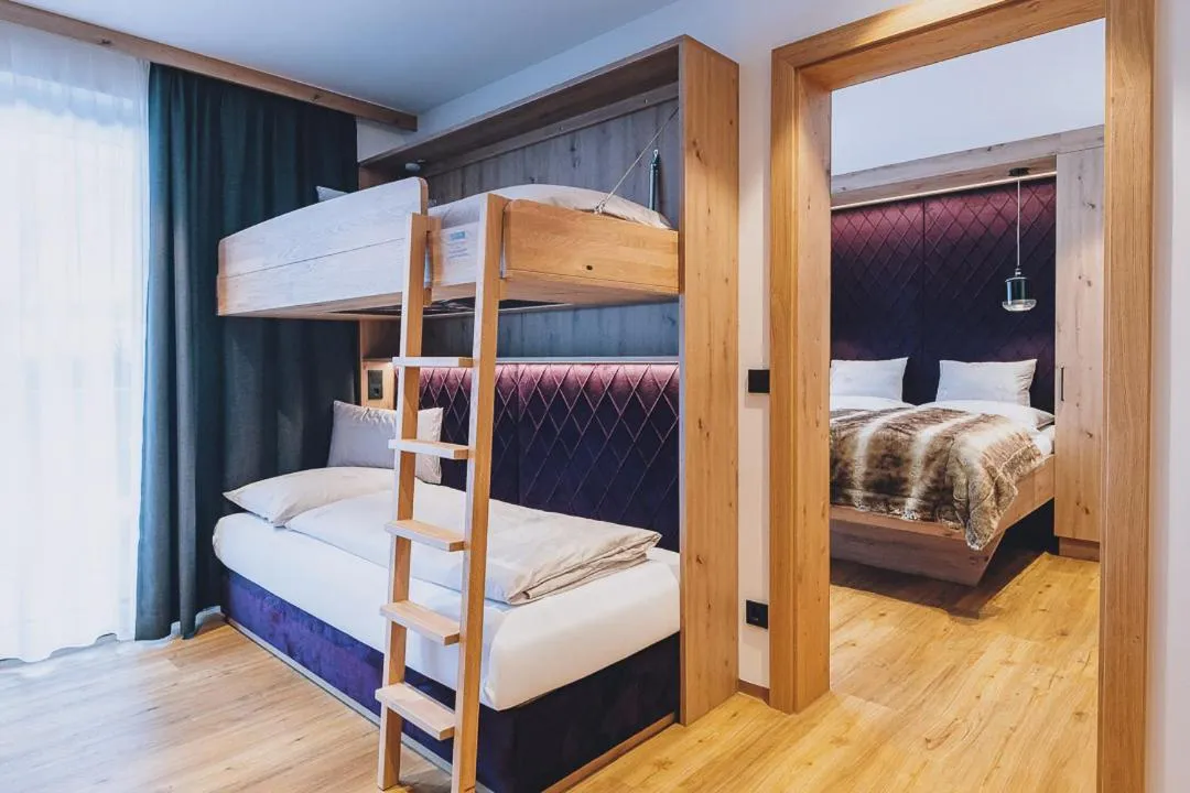 Bed in Dorfkrug Kaprun - Luxury Suites & Appartements