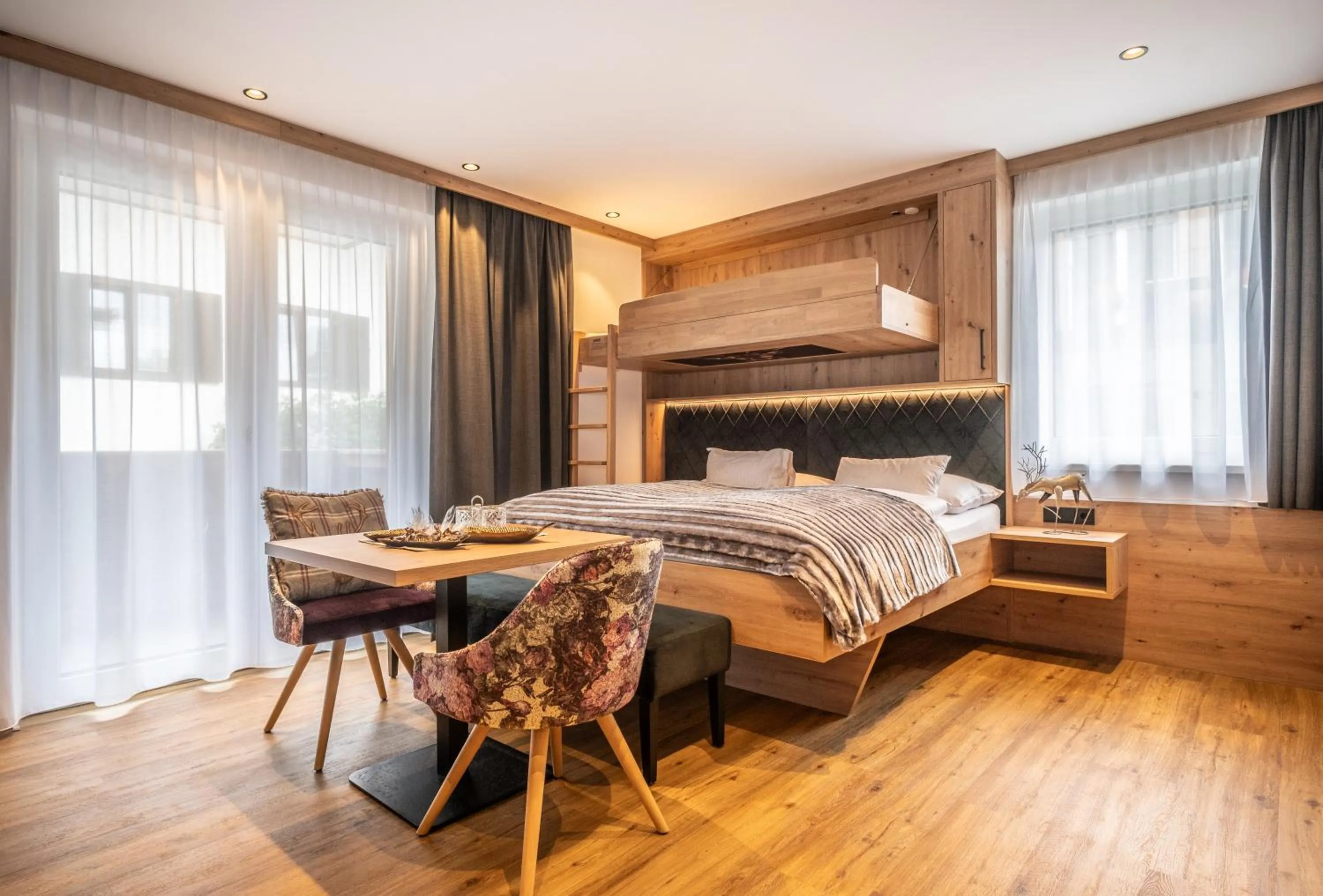 Bed in Dorfkrug Kaprun - Luxury Suites & Appartements
