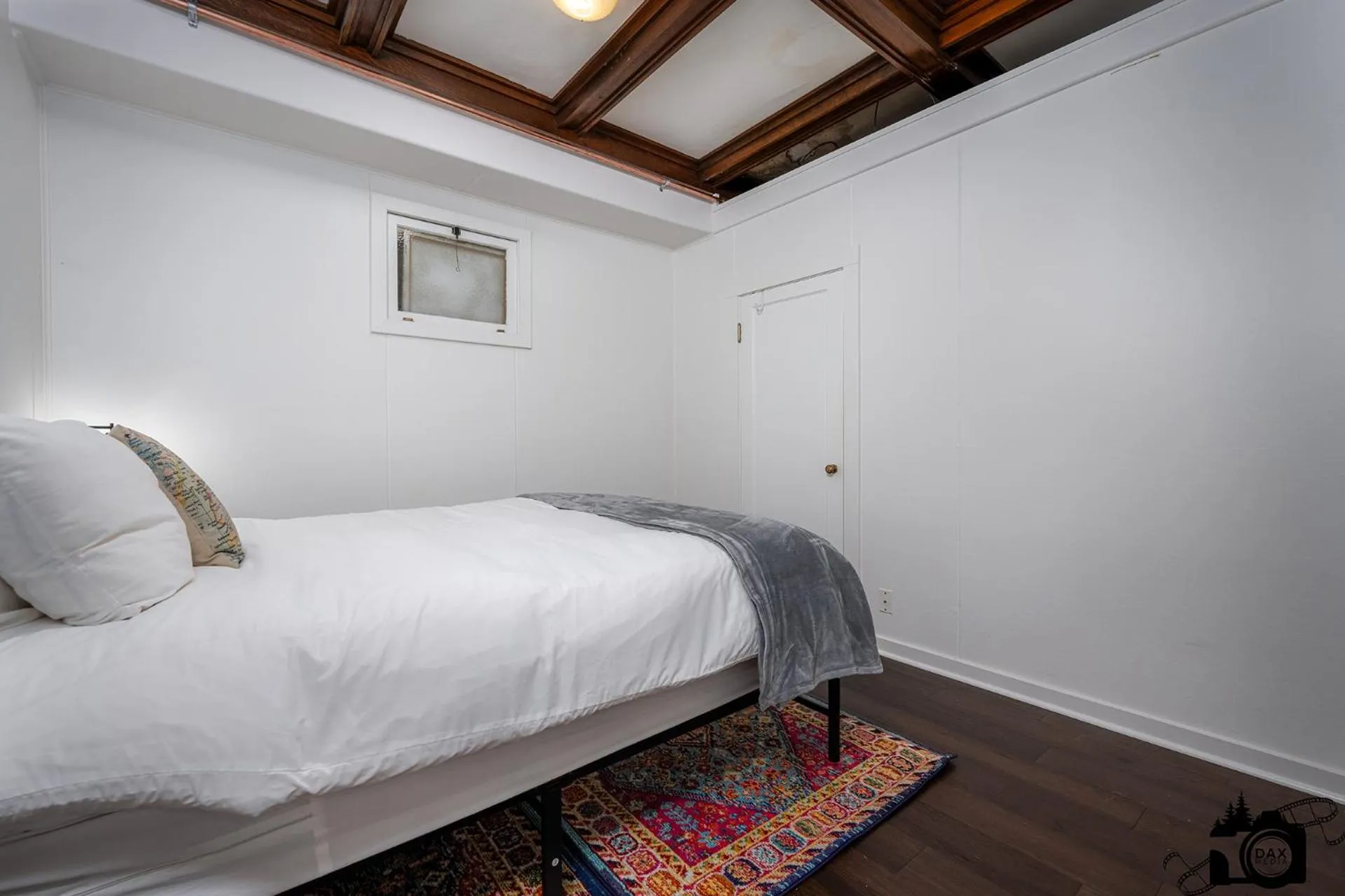 Bed in Brown & Hawkins Historical Apartments