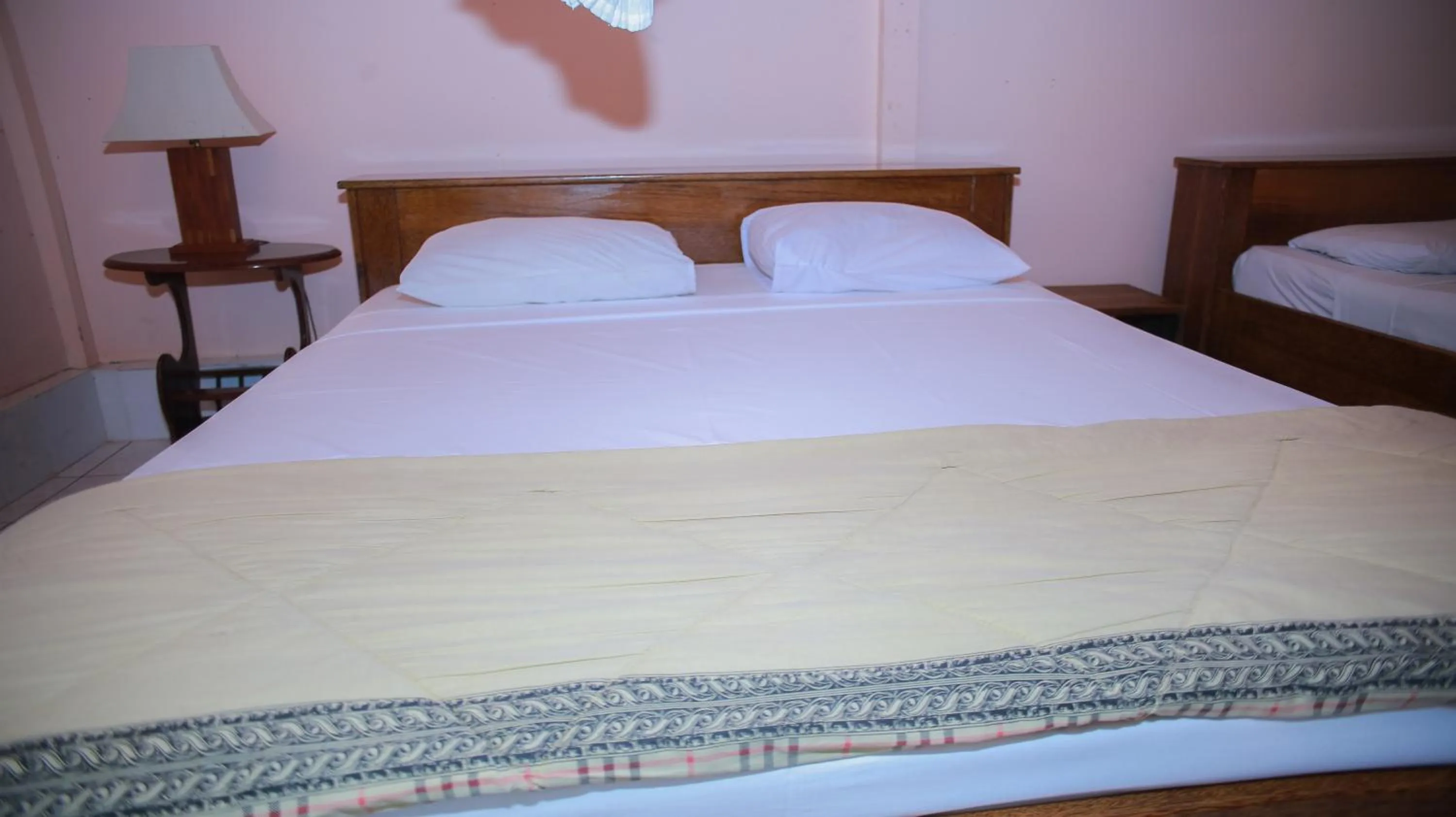 Bed in Sea World Club Beach Resort & Dive Center, RESORT THAT SUPPORTS THE POOR