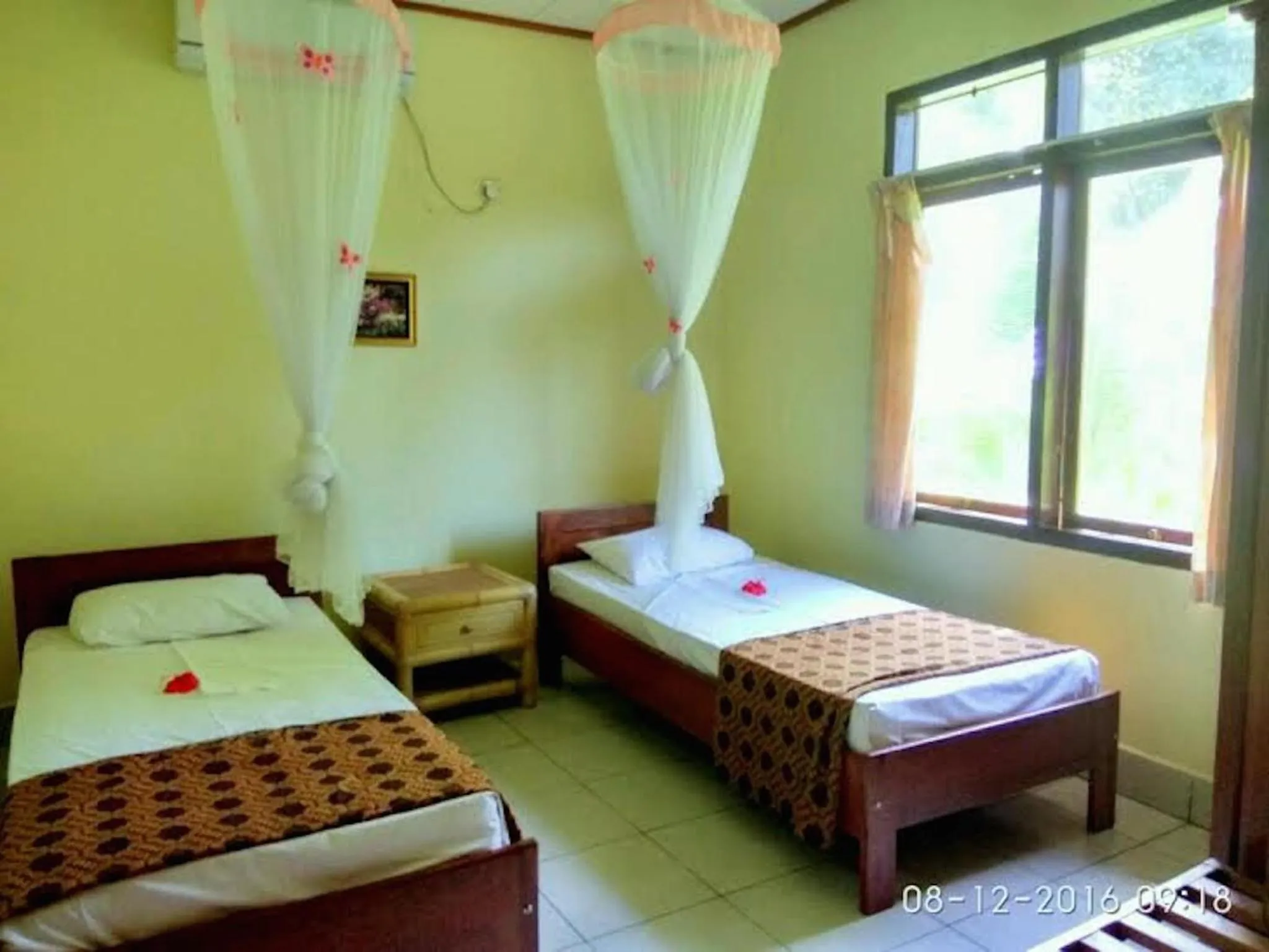 Bed in Sea World Club Beach Resort & Dive Center, RESORT THAT SUPPORTS THE POOR
