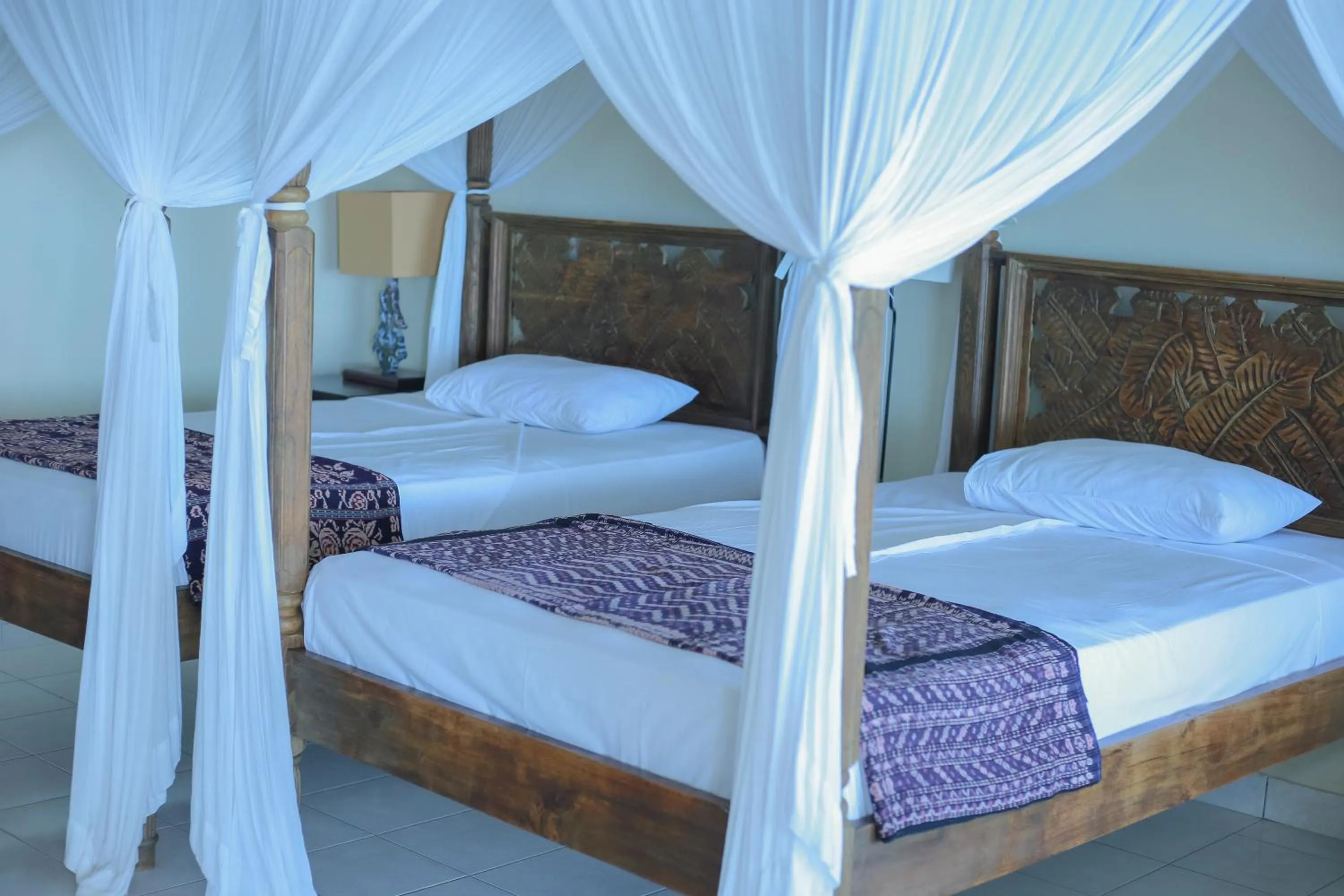 Bed in Sea World Club Beach Resort & Dive Center, RESORT THAT SUPPORTS THE POOR