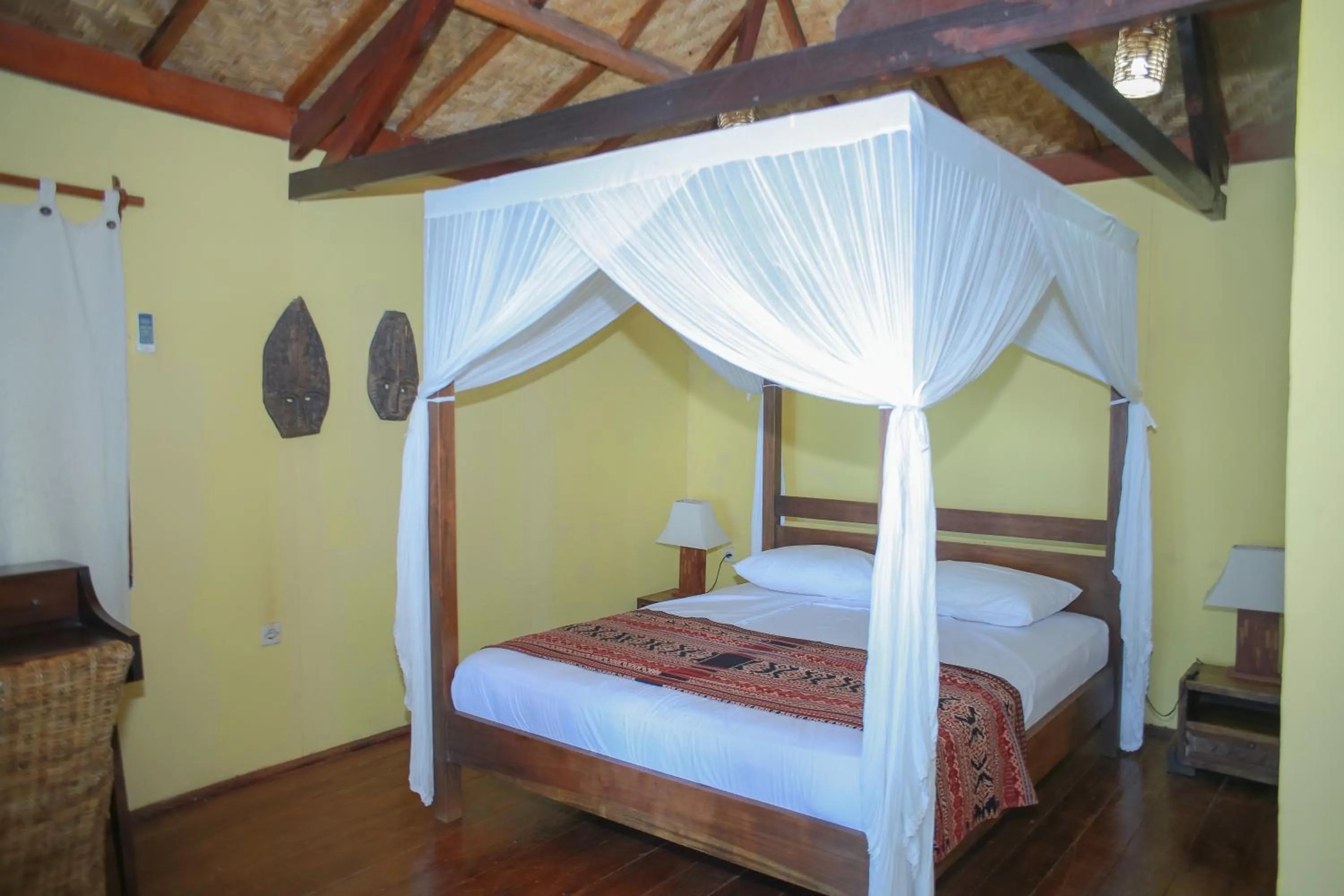 Bed in Sea World Club Beach Resort & Dive Center, RESORT THAT SUPPORTS THE POOR