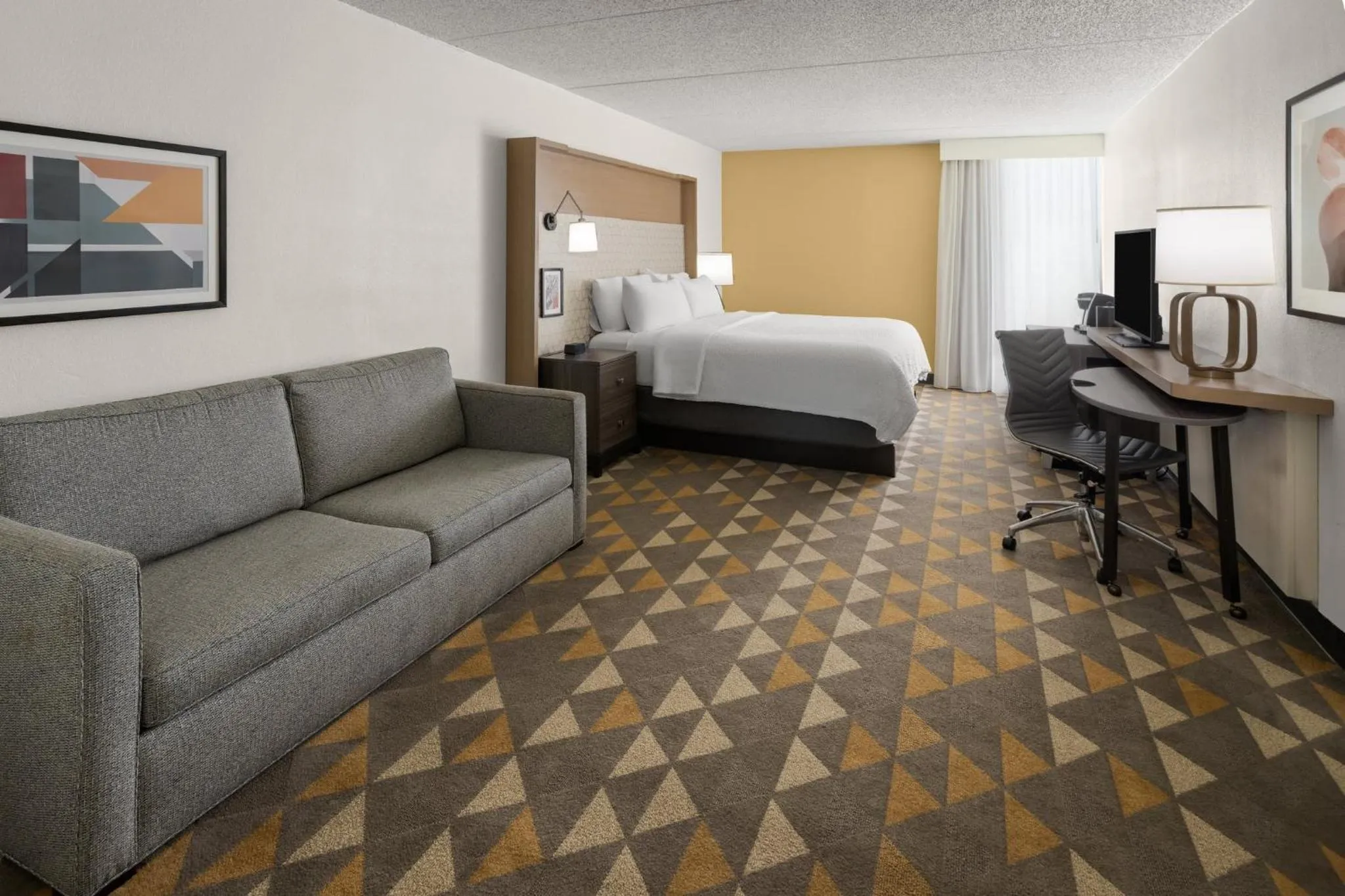 Photo of the whole room, Bed in Holiday Inn Morgantown - Reading Area by IHG