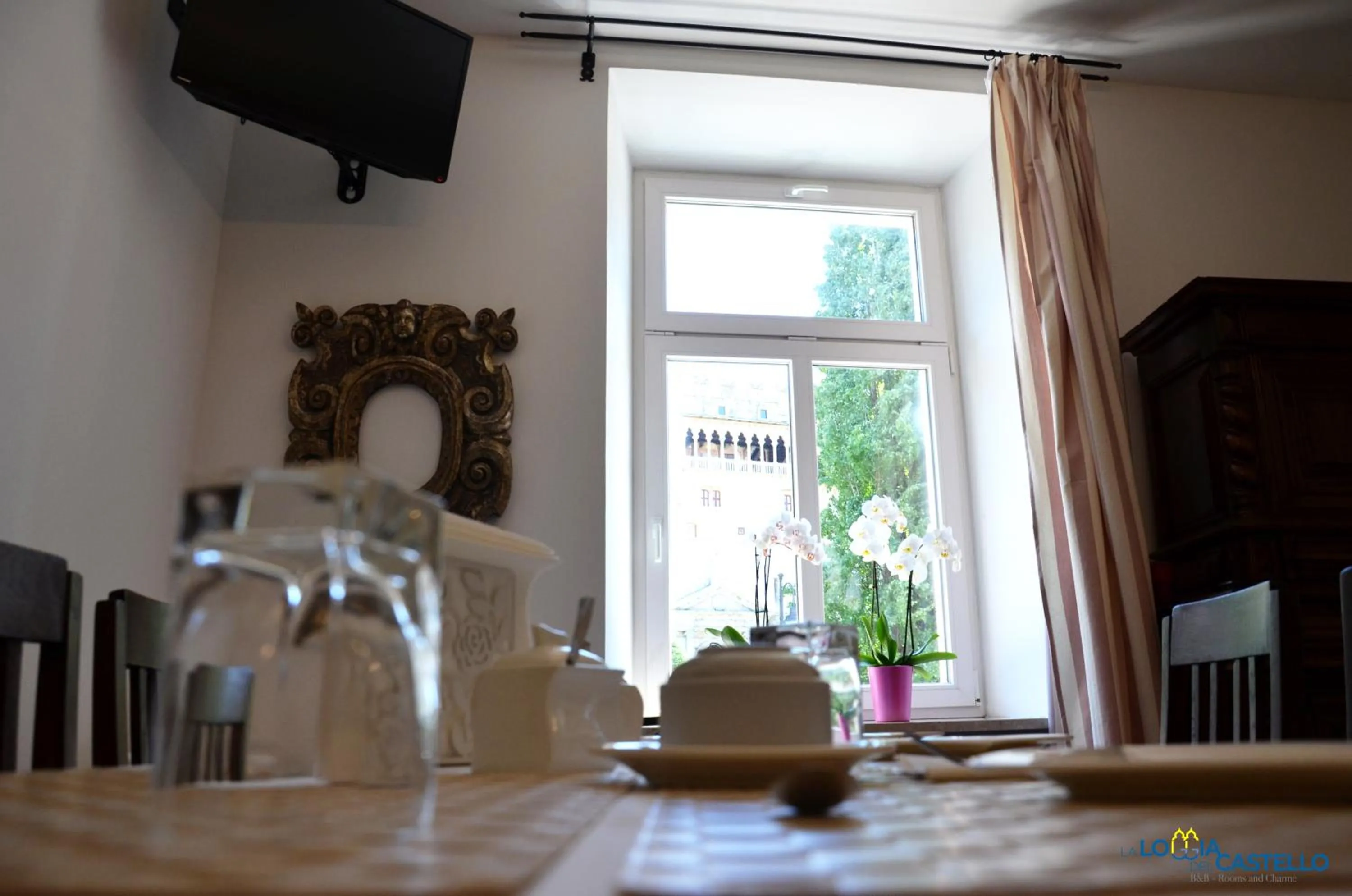 Communal lounge/ TV room in B&B La Loggia Del Castello