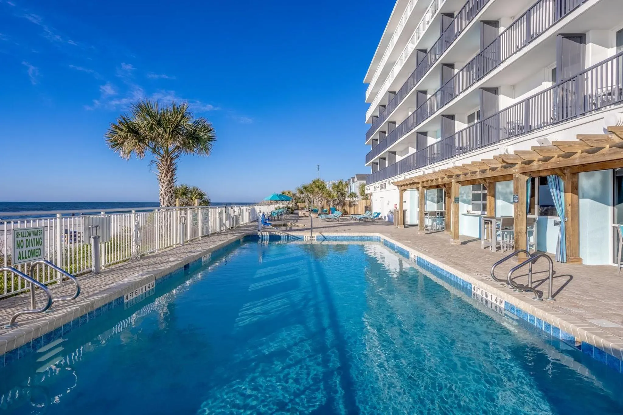 Pool view in Holiday Inn Resort Oceanfront at Surfside Beach by IHG