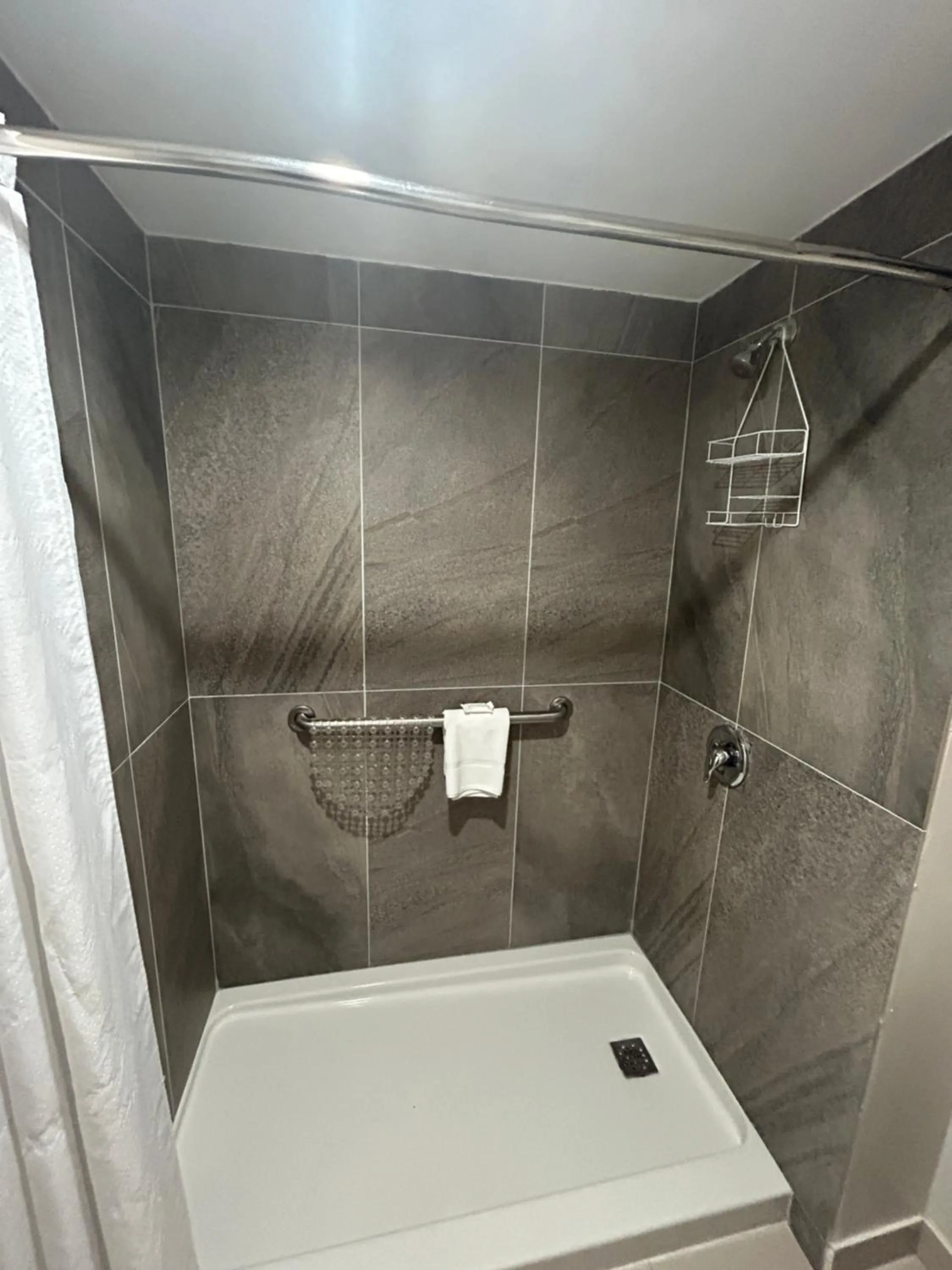 Bathroom in HOM Hotel Gainesville, SureStay Collection by Best Western