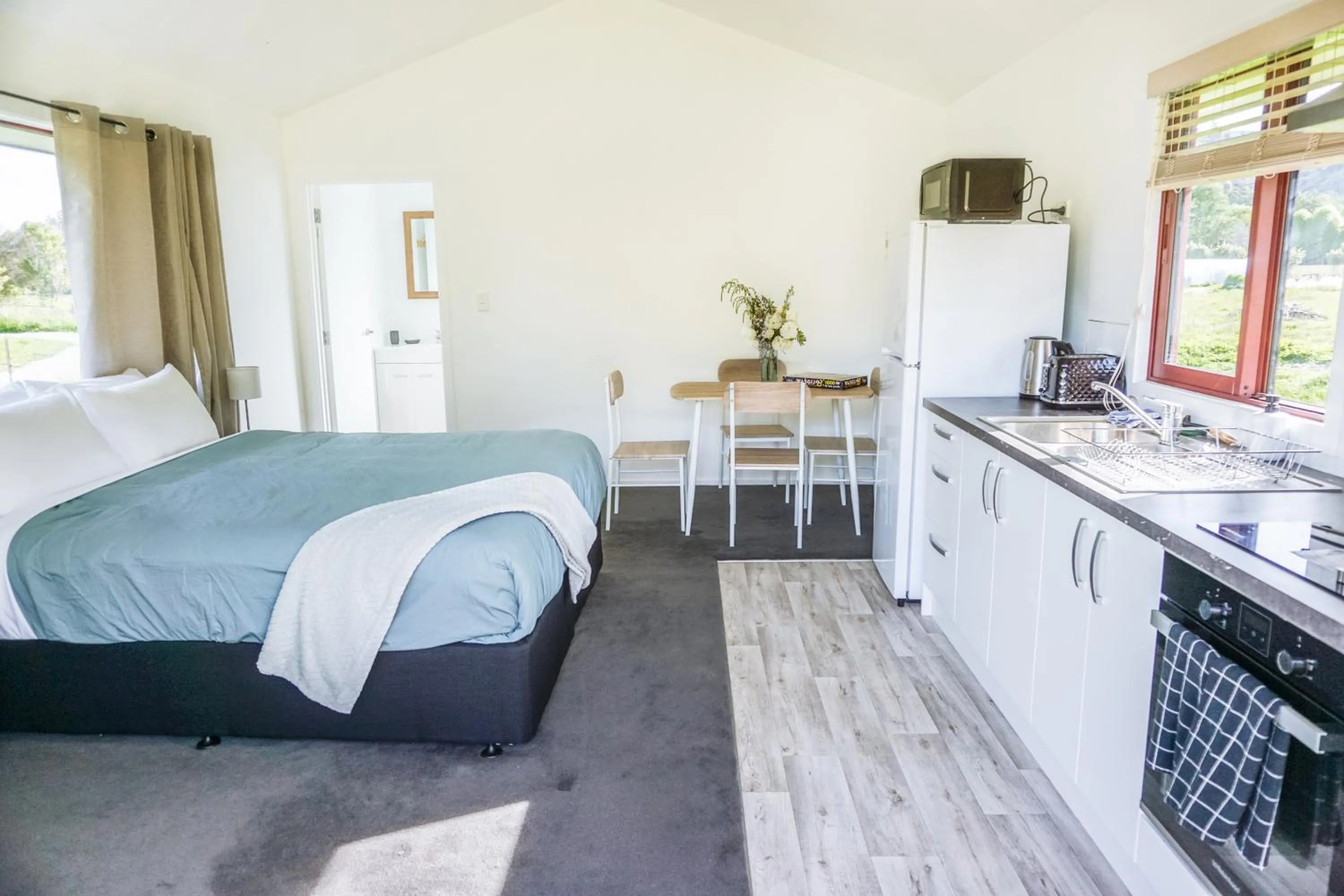 Bathroom, Bed in The Barn Cabins & Camp