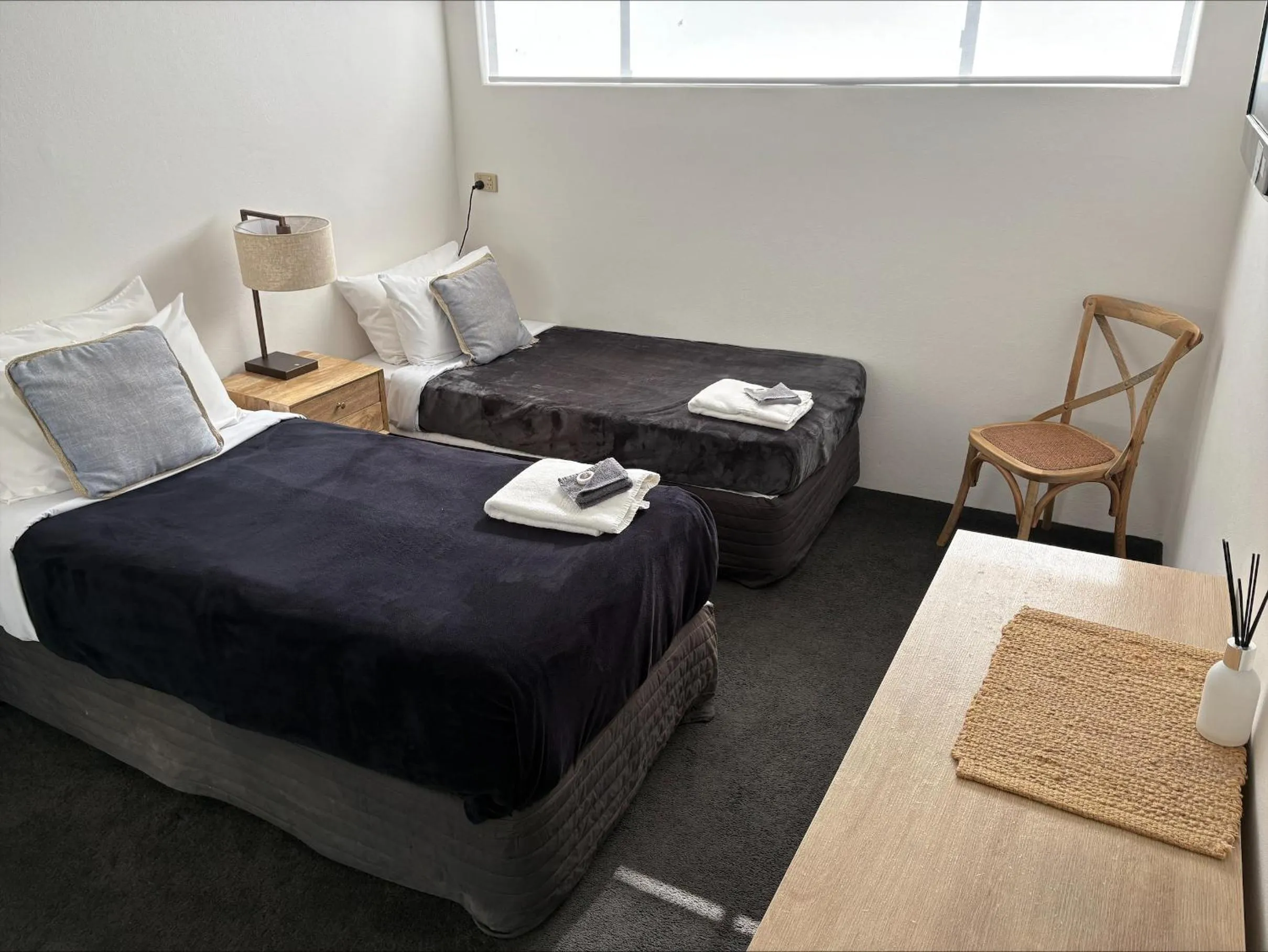 Bed in Tall Timbers Motel