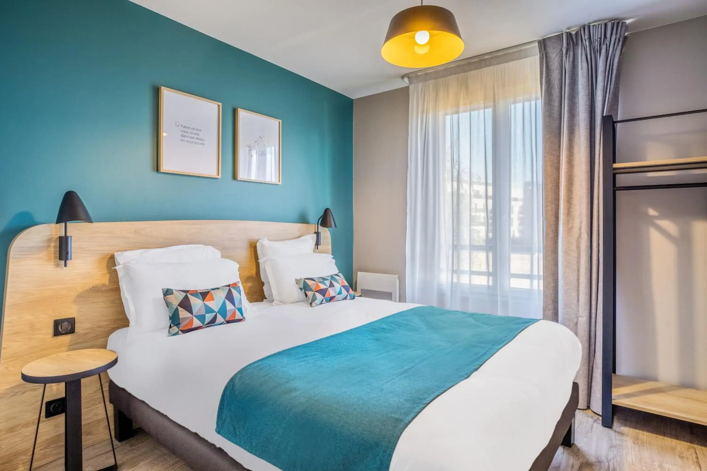 Bed in Appart'City Confort Versailles Bois d'Arcy (Ex Park&Suites)