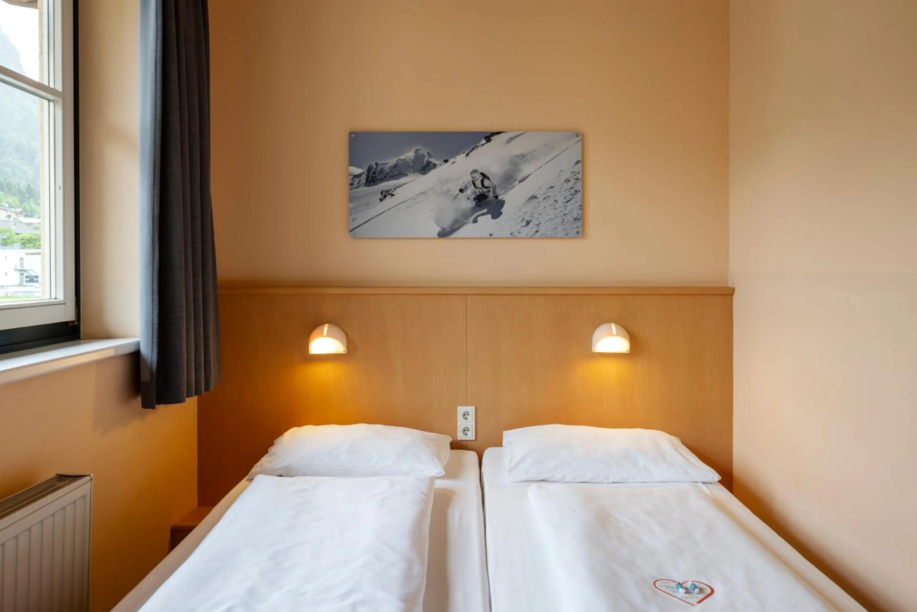 Photo of the whole room, Bed in JUFA Hotel Kaprun - Summercard included