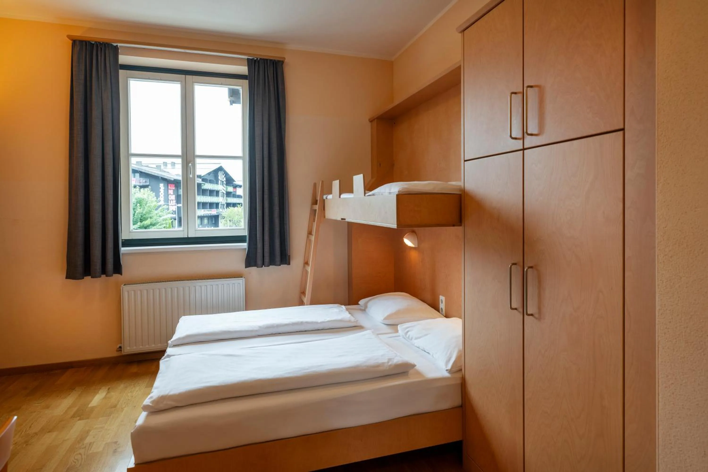 Photo of the whole room, Bed in JUFA Hotel Kaprun - Summercard included