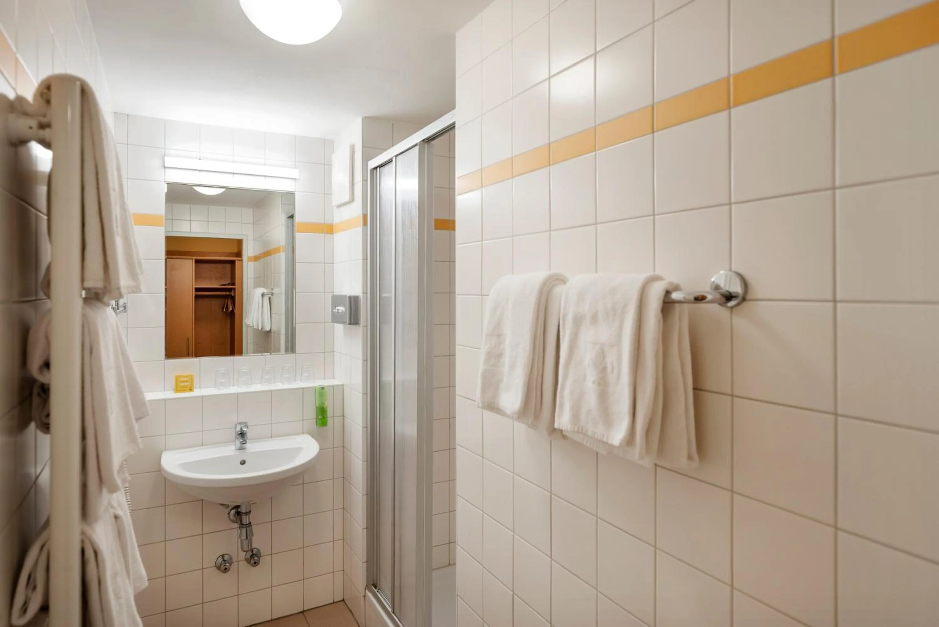 Bathroom in JUFA Hotel Kaprun - Summercard included