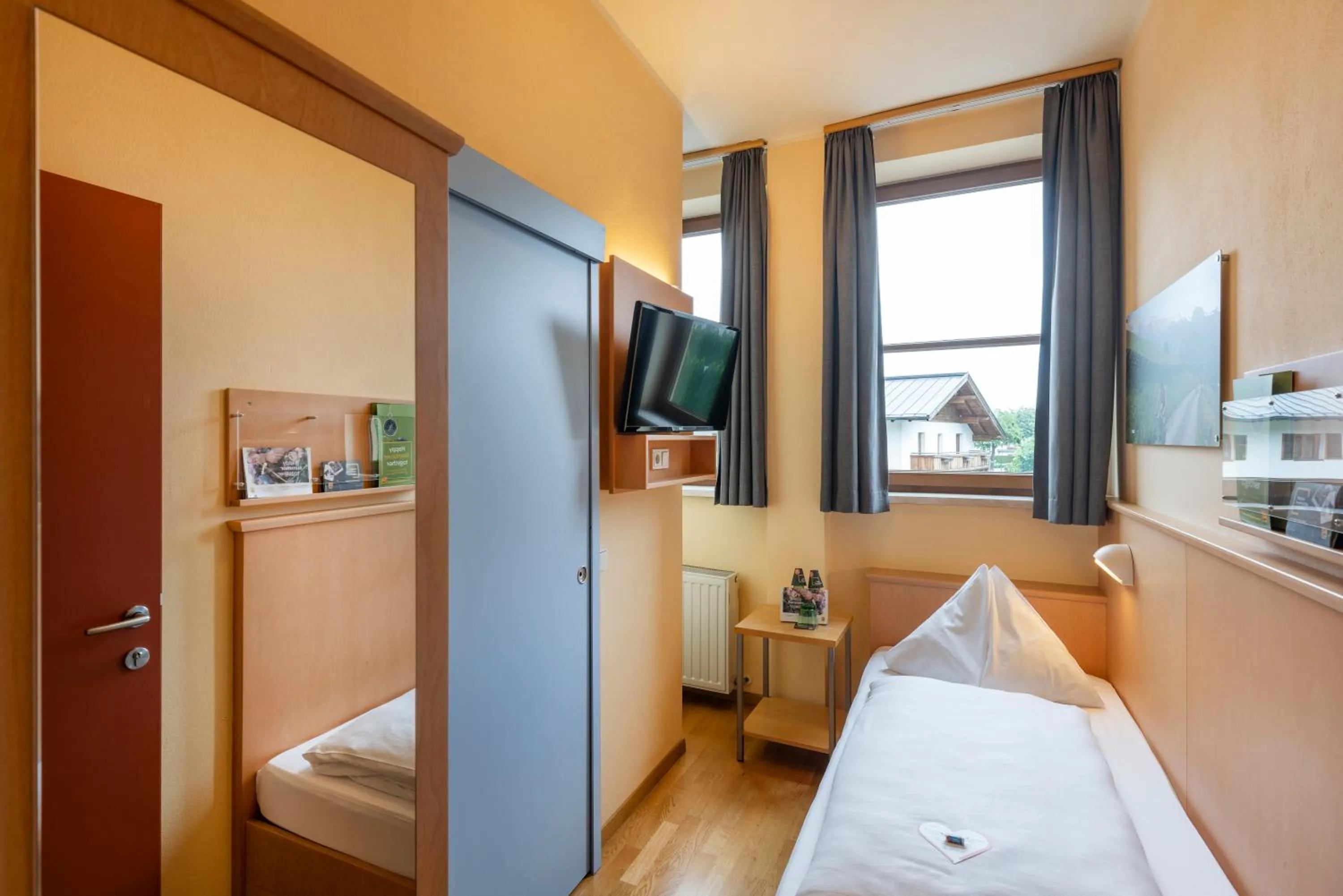 Photo of the whole room, Bed in JUFA Hotel Kaprun - Summercard included