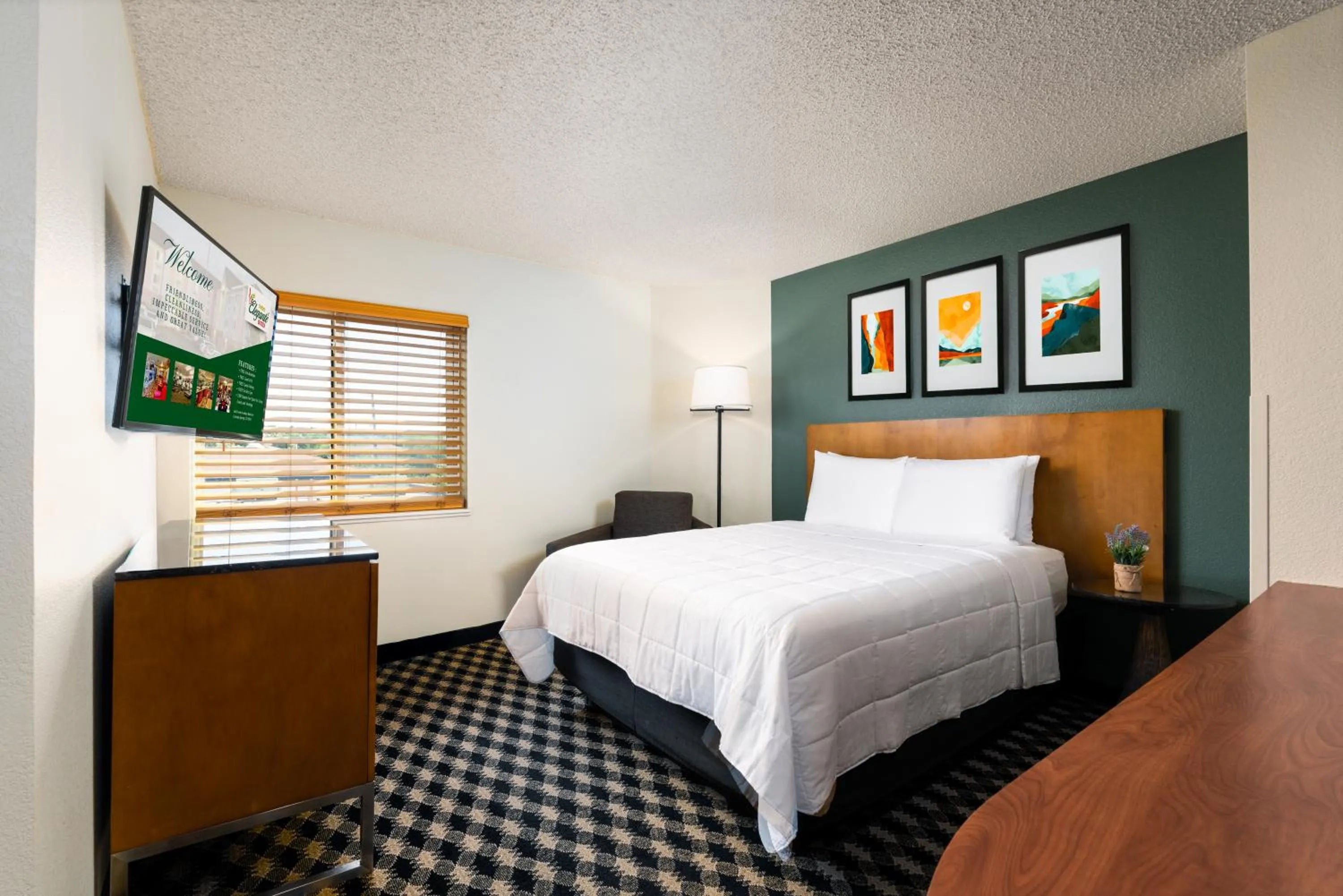 Bed in MCM Elegante Suites