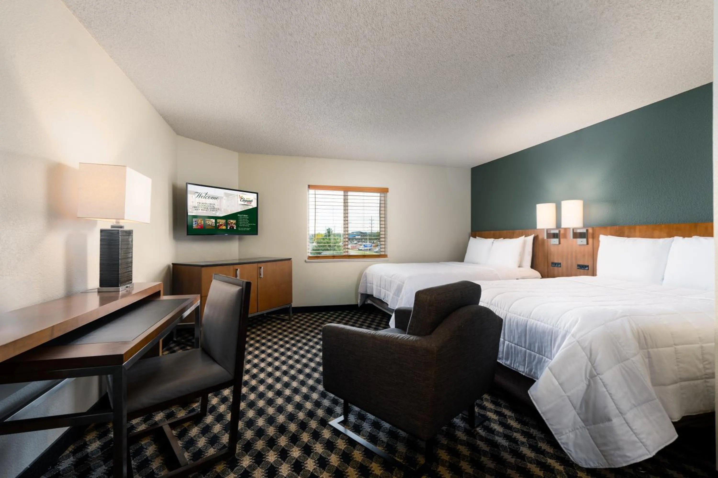 Bed in MCM Elegante Suites