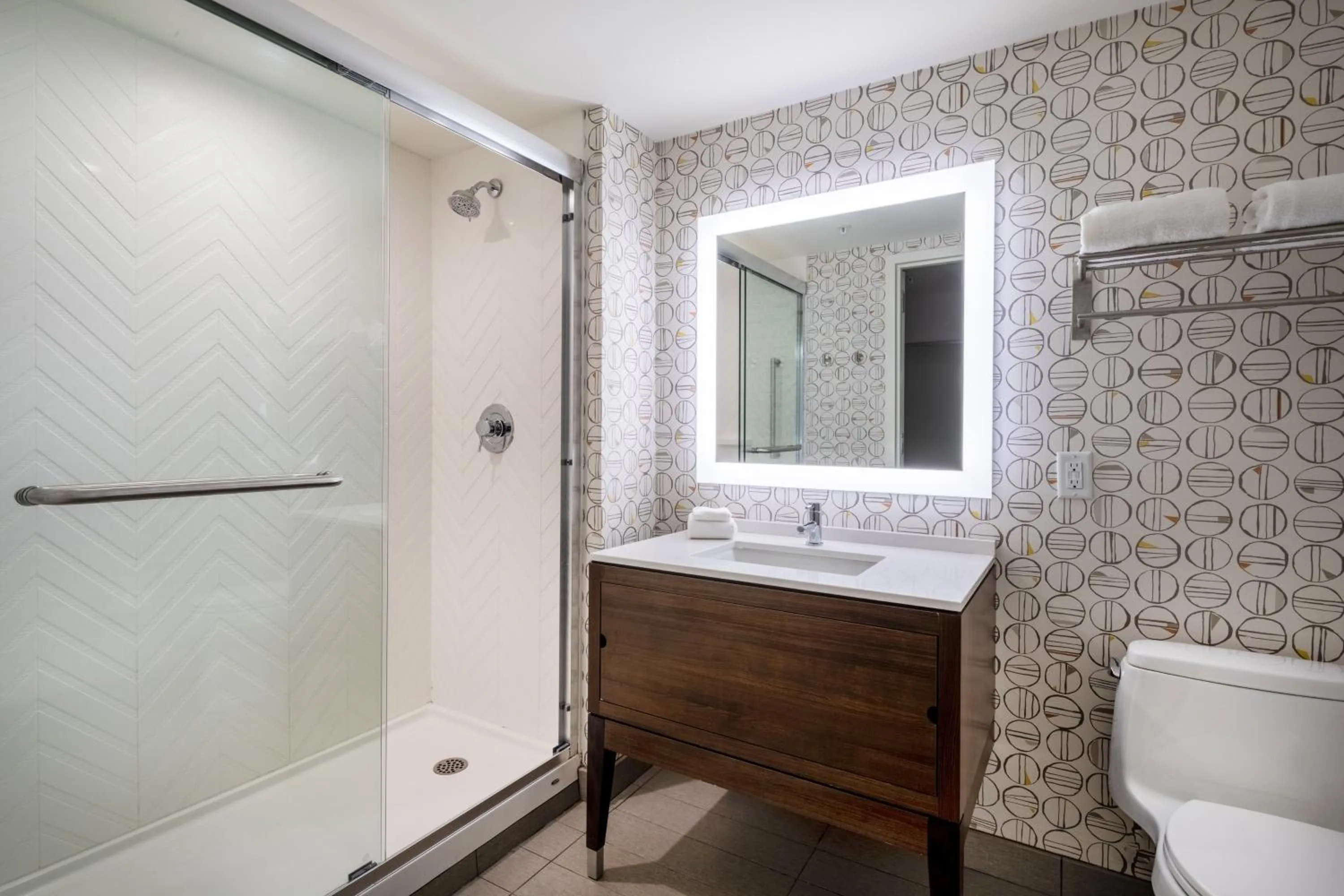 Bathroom in Holiday Inn - Long Island - ISLIP Arpt East by IHG
