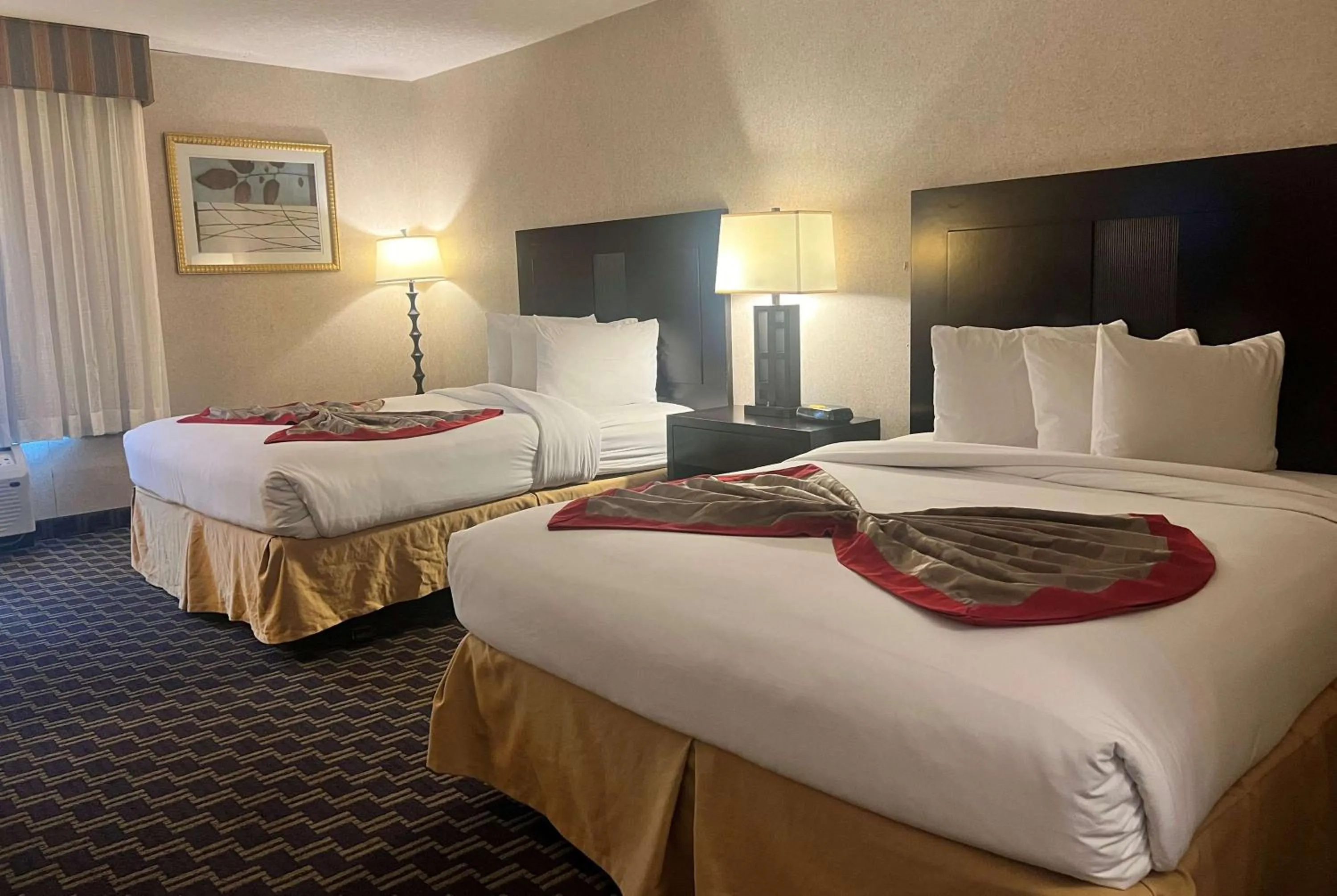 Photo of the whole room, Bed in Ramada by Wyndham Jacksonville I-95 by Butler Blvd