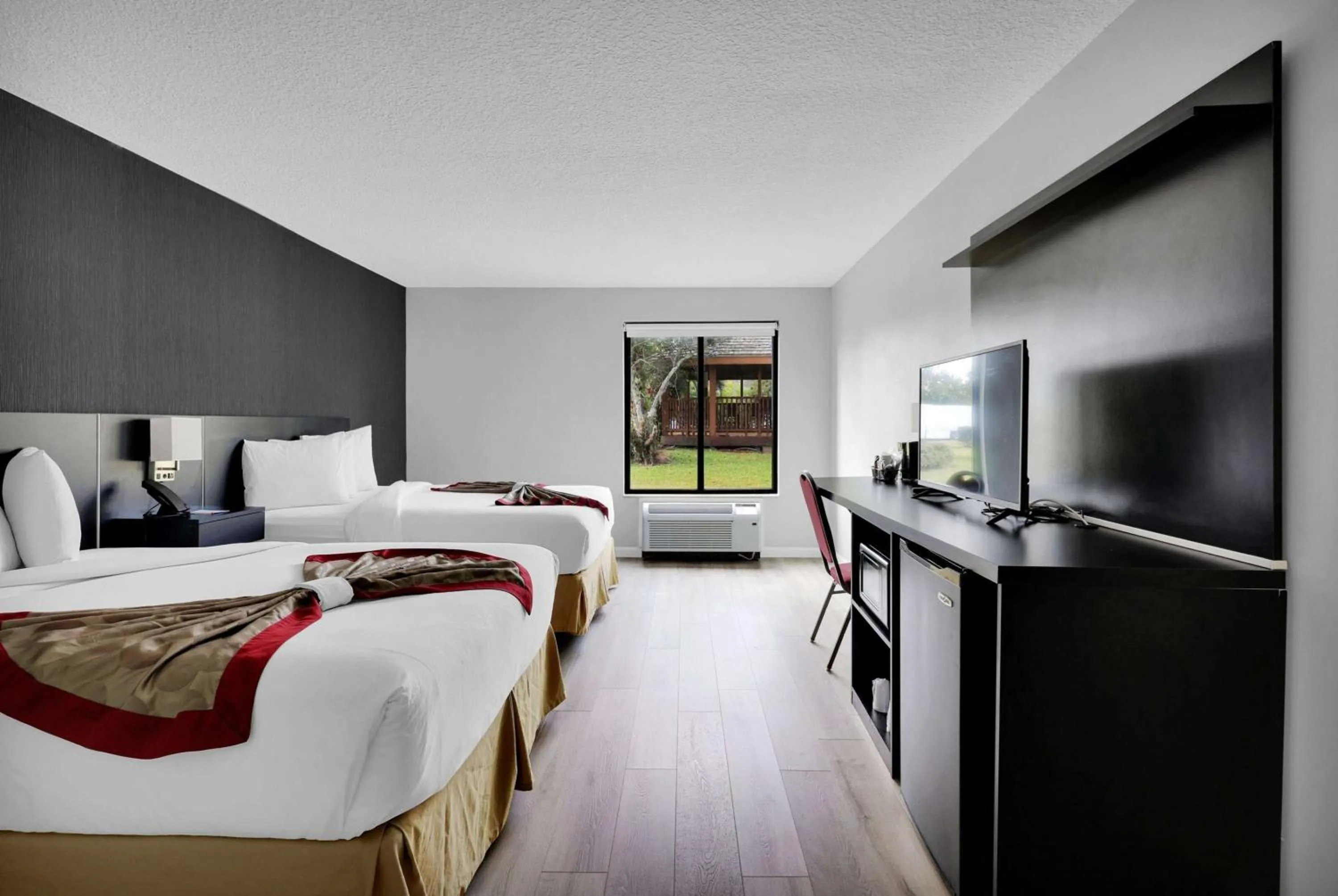 Photo of the whole room, Bed in Ramada by Wyndham Jacksonville I-95 by Butler Blvd