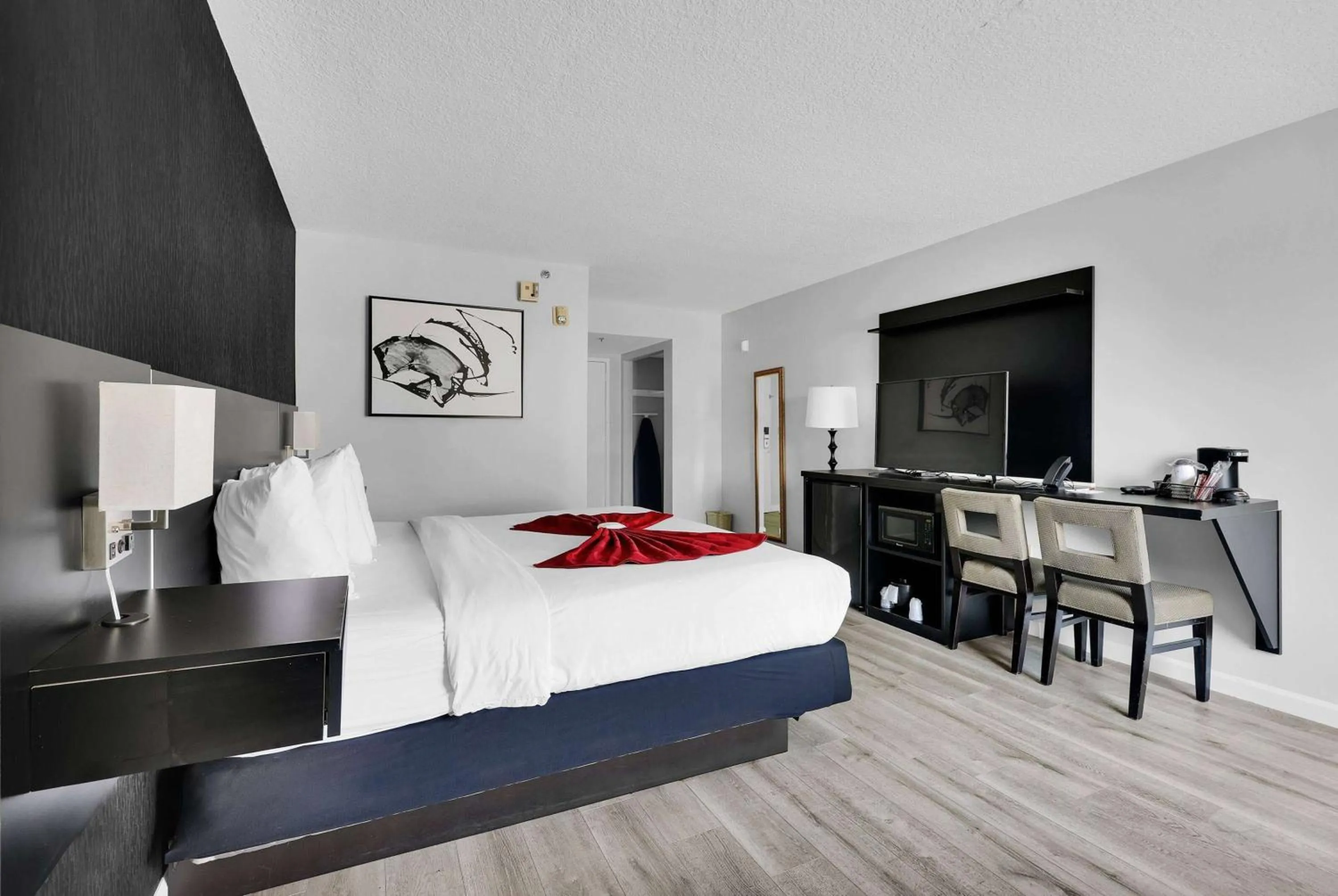 Photo of the whole room, Bed in Ramada by Wyndham Jacksonville I-95 by Butler Blvd