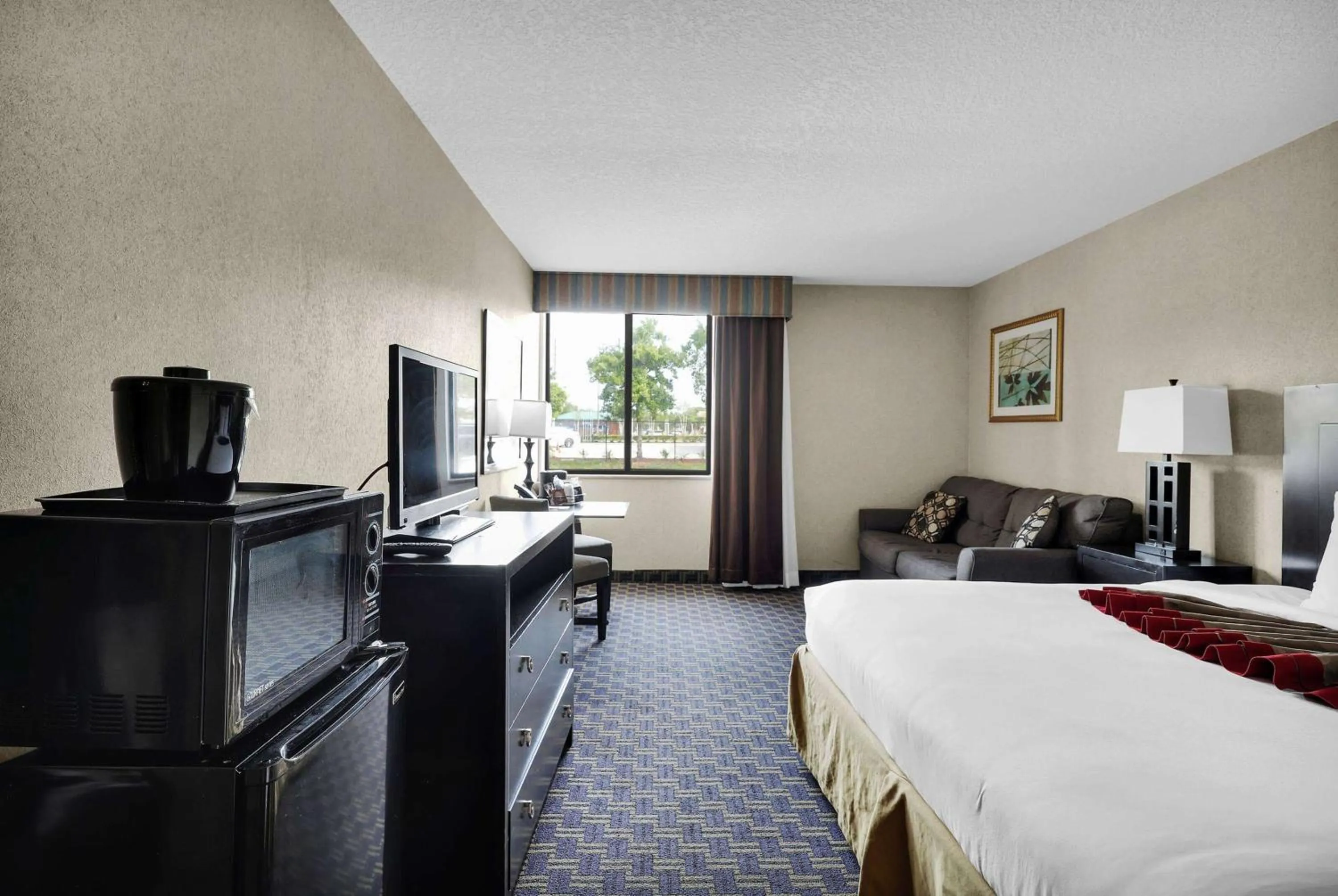Photo of the whole room, Bed in Ramada by Wyndham Jacksonville I-95 by Butler Blvd