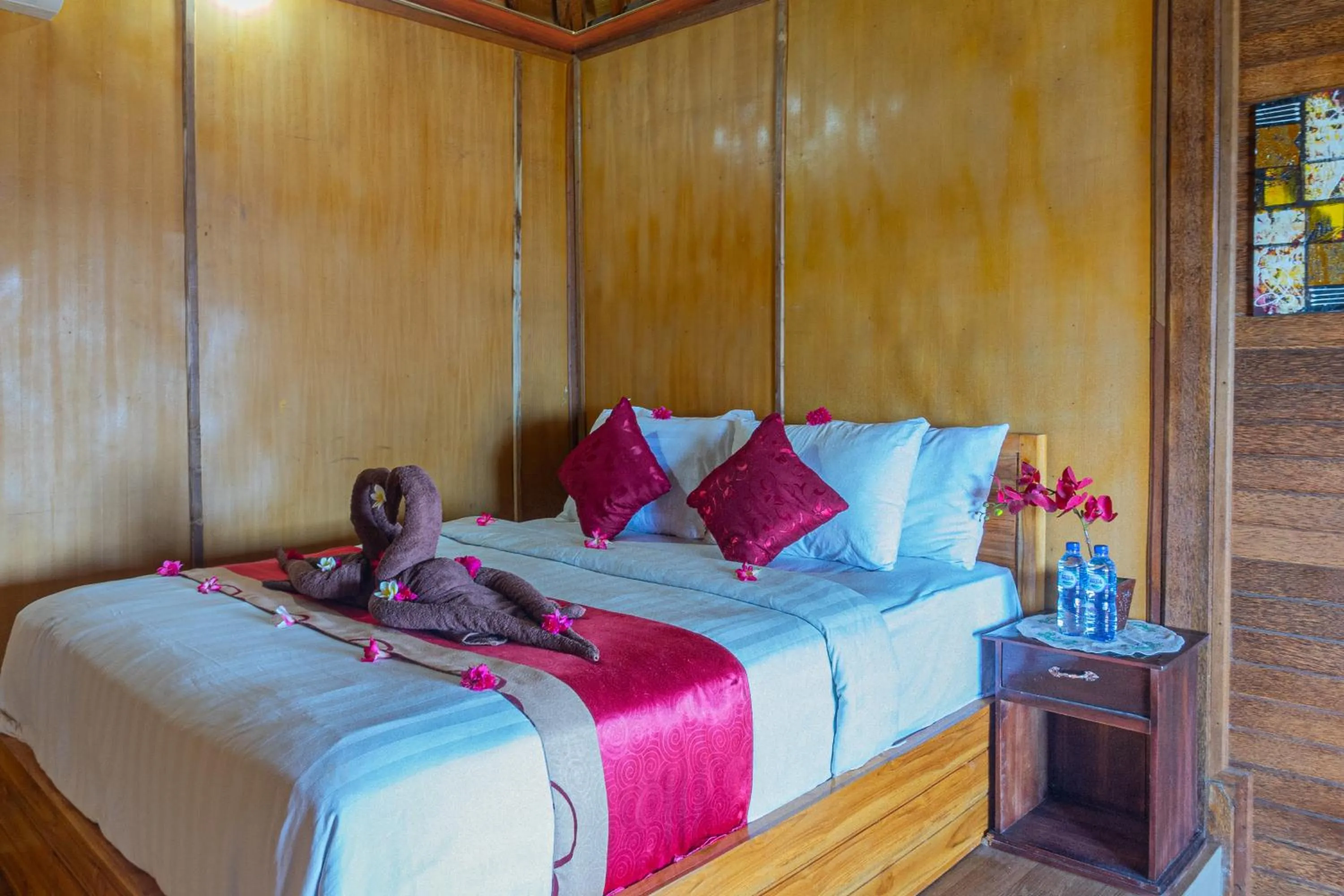 Bed in Manta Cottages with Sea View