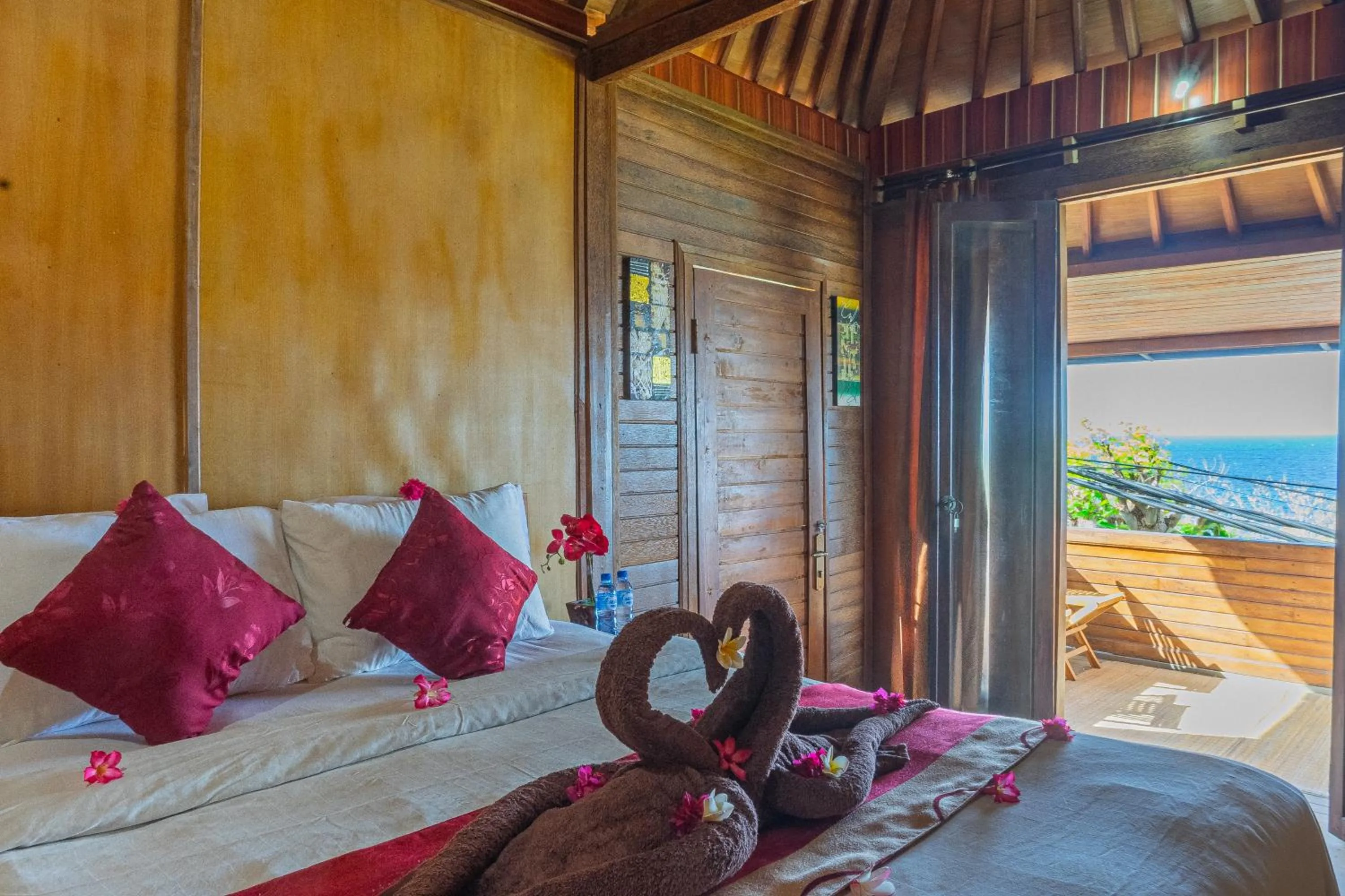 Bed in Manta Cottages with Sea View