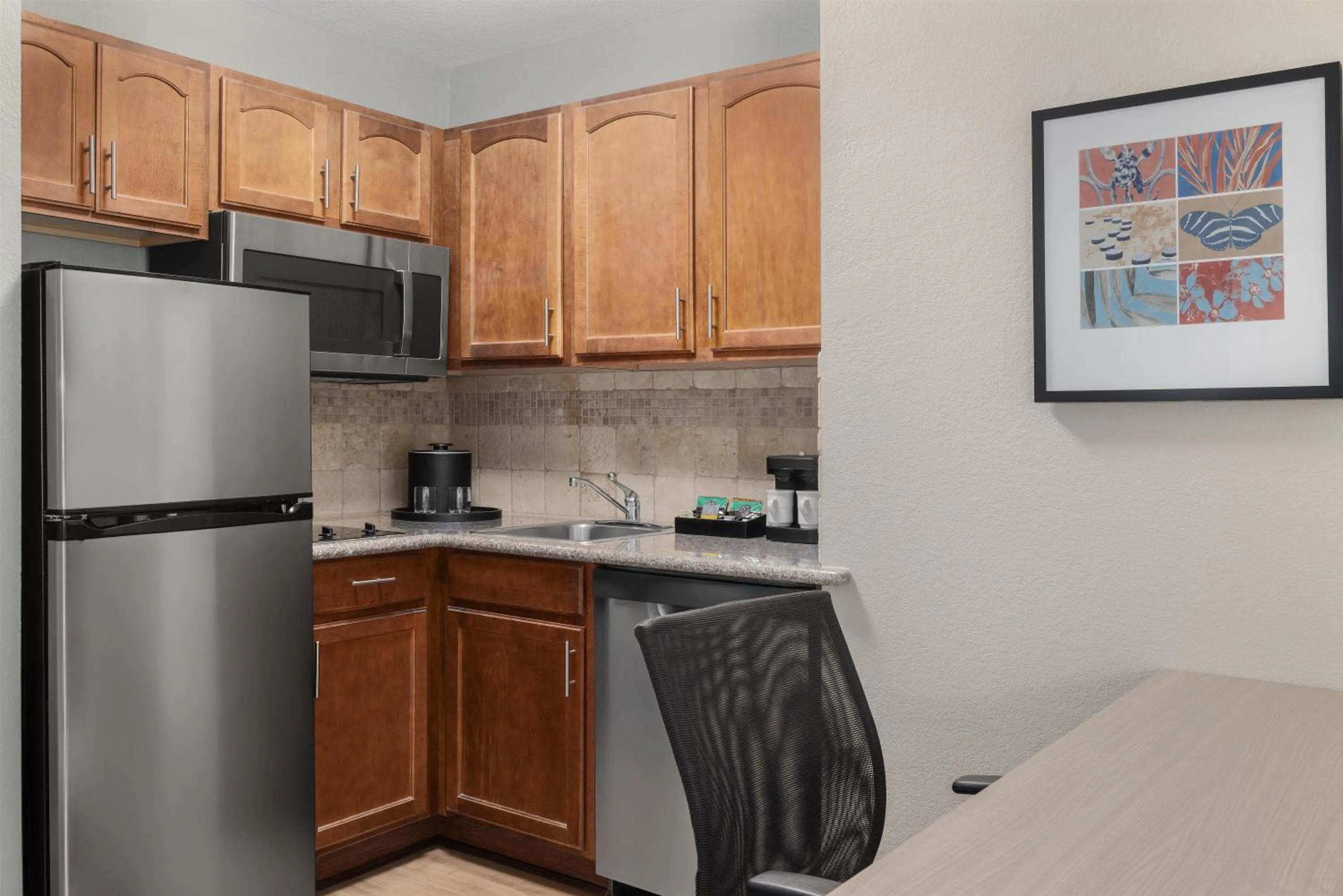 Kitchen or kitchenette in Homewood Suites Jacksonville Deerwood Park