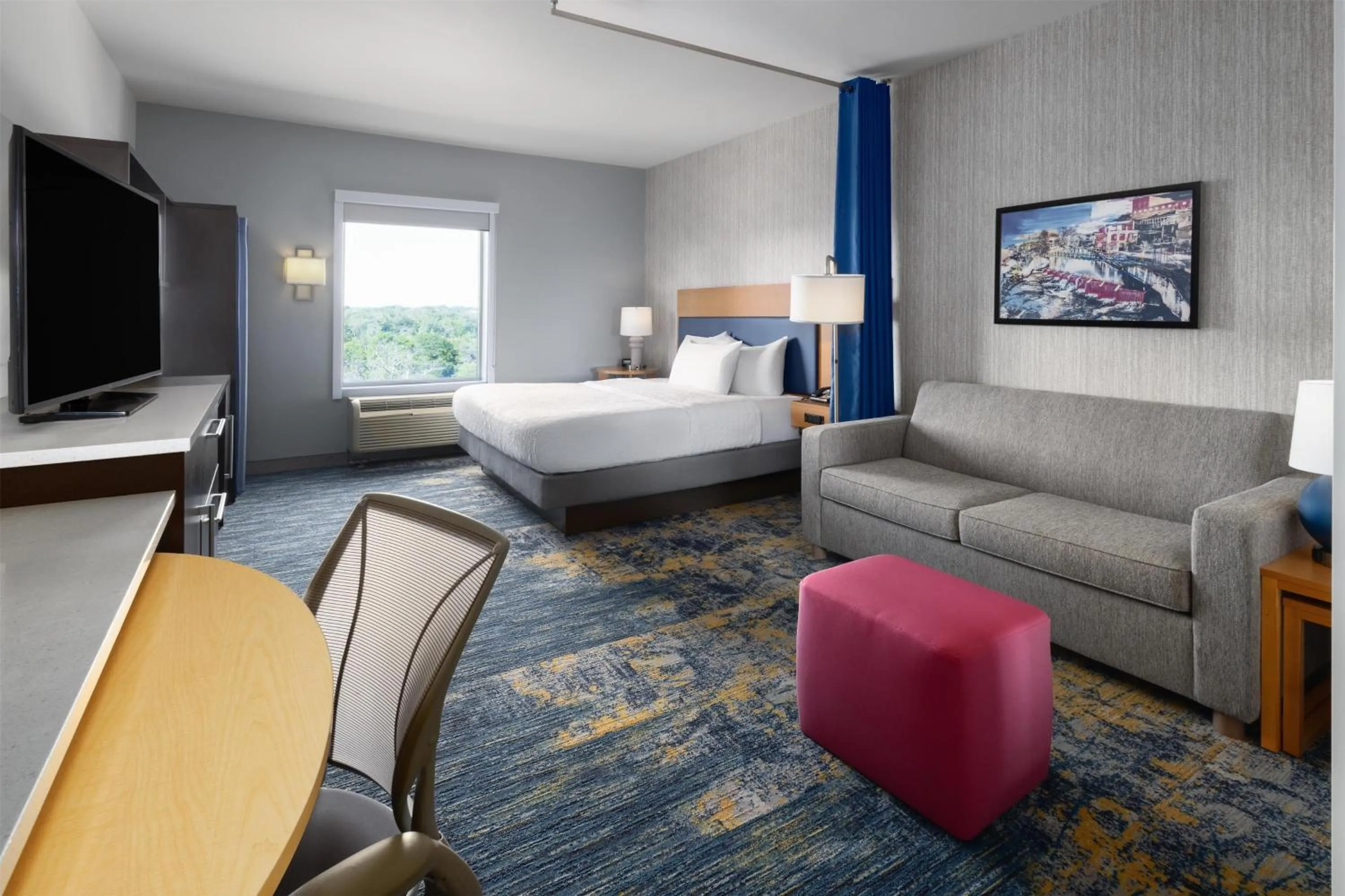 Living room, Bed in Home2 Suites by Hilton Greenville Downtown