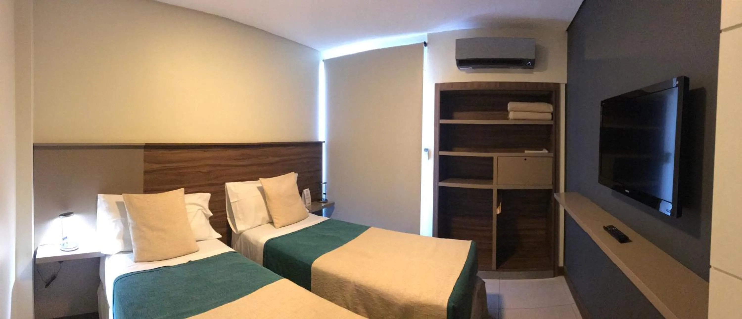 Bed in H1 Apartments Hotel