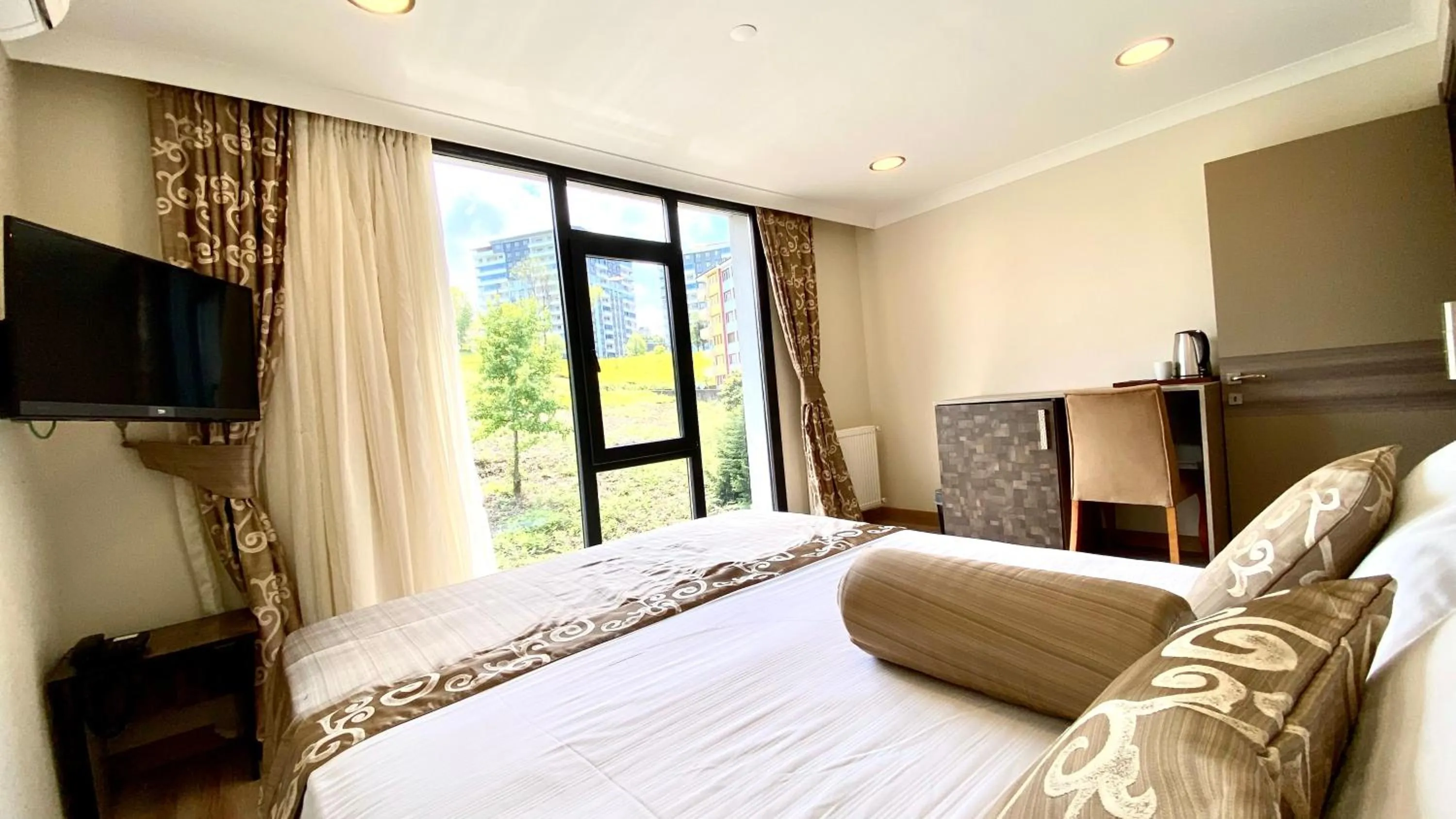 Bed in Caykent Suites Deluxe Hotel