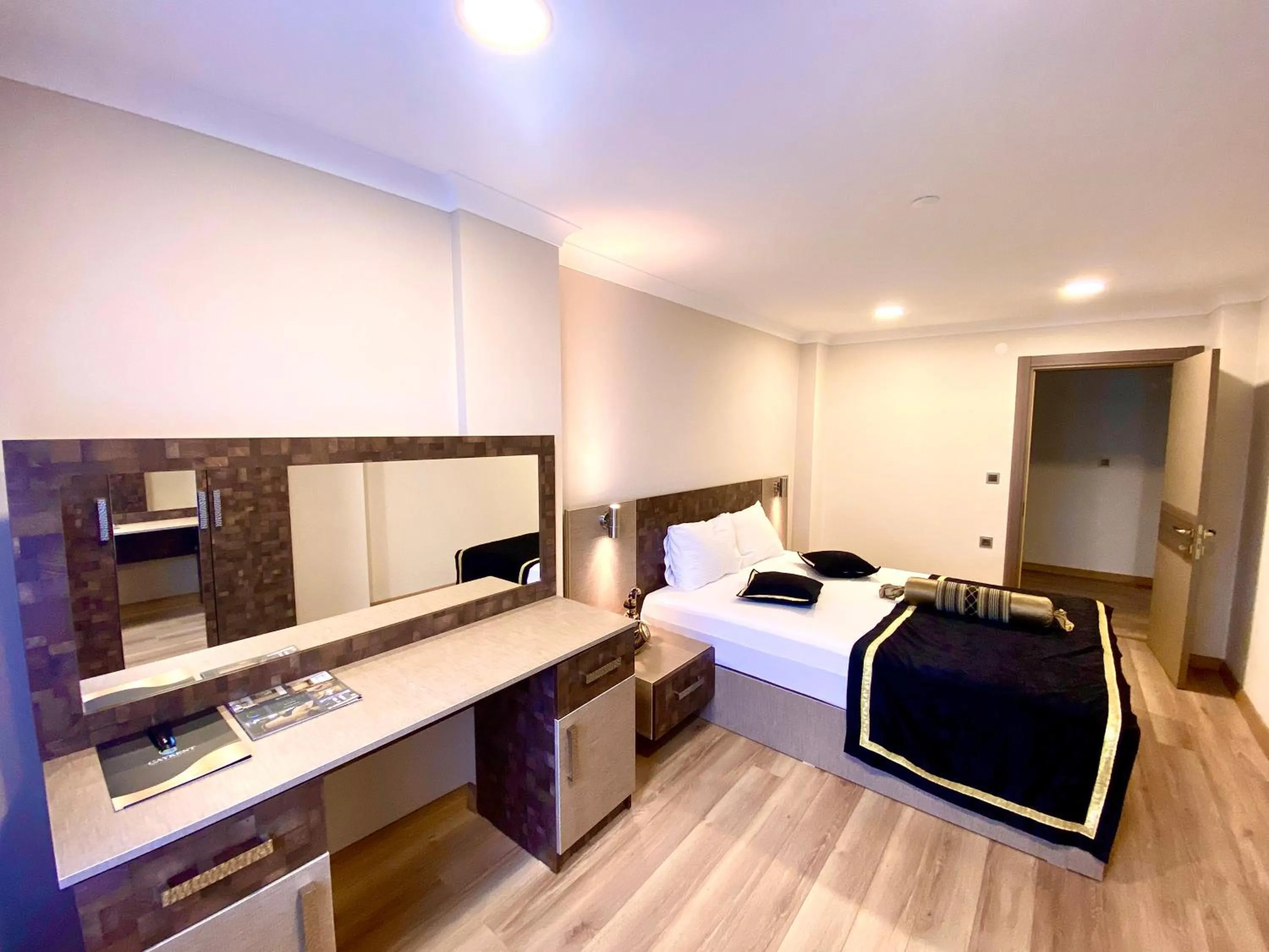 Bed in Caykent Suites Deluxe Hotel
