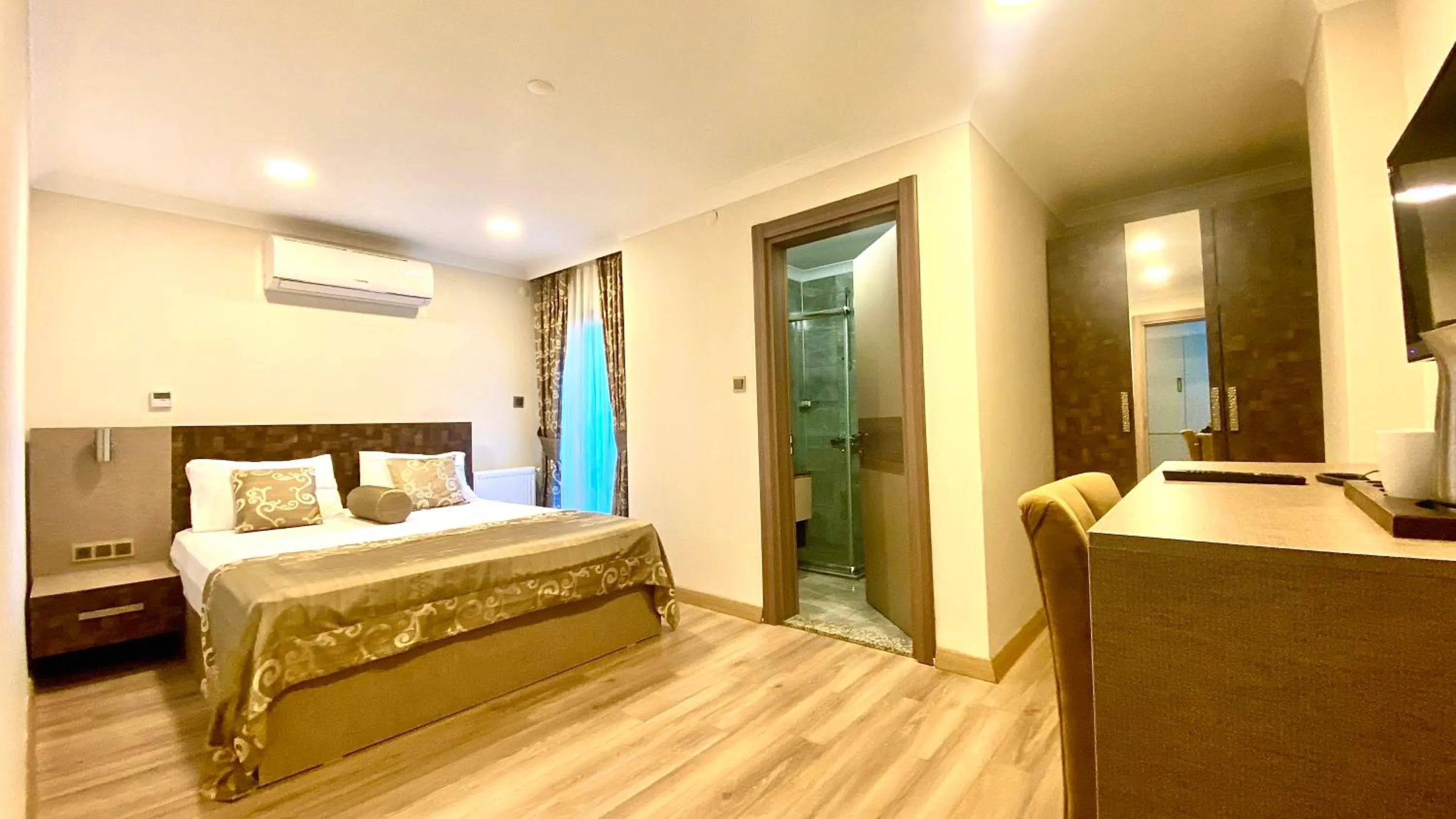 Bed in Caykent Suites Deluxe Hotel