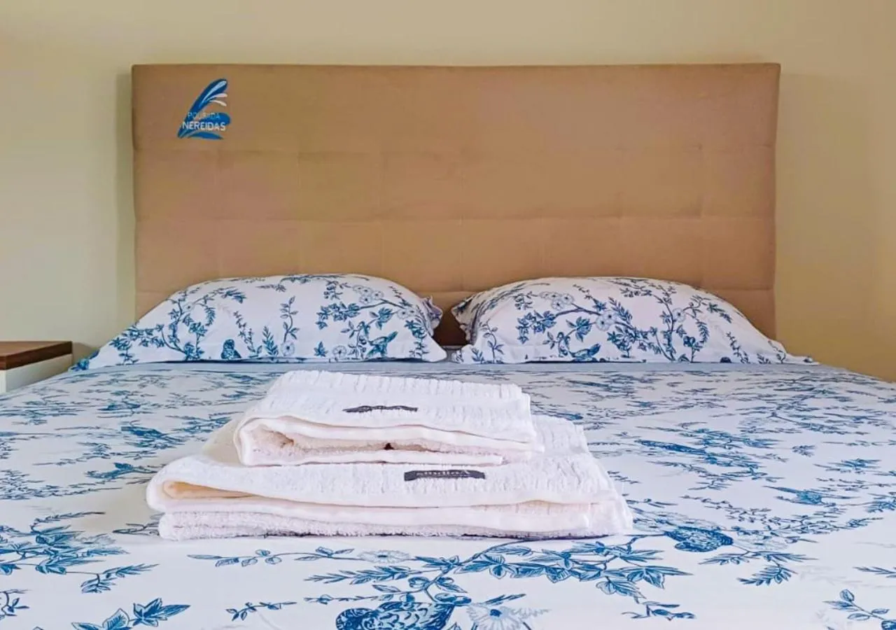 Bed in Pousada Nereidas