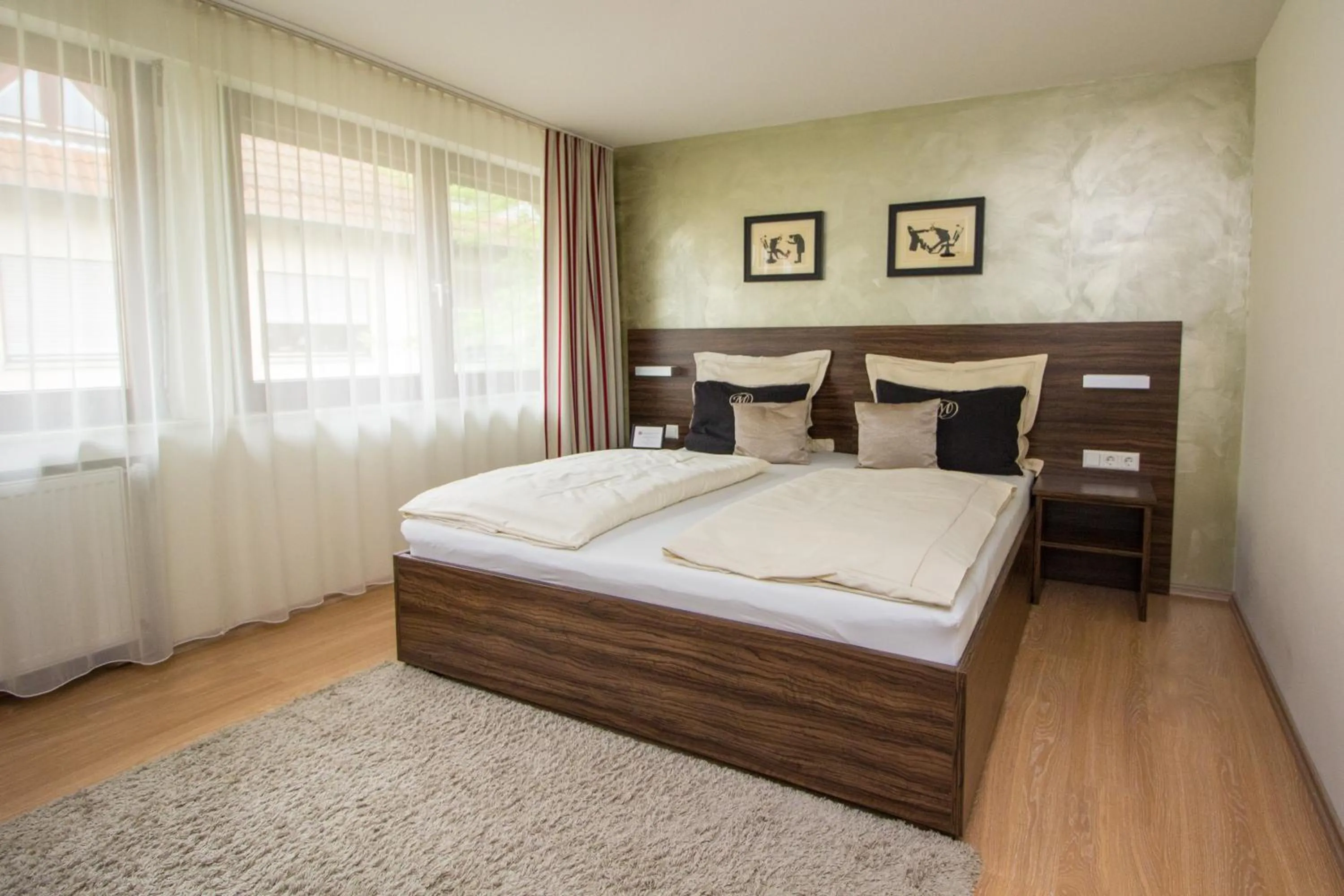 Photo of the whole room, Bed in Landhotel Wolfschlugen