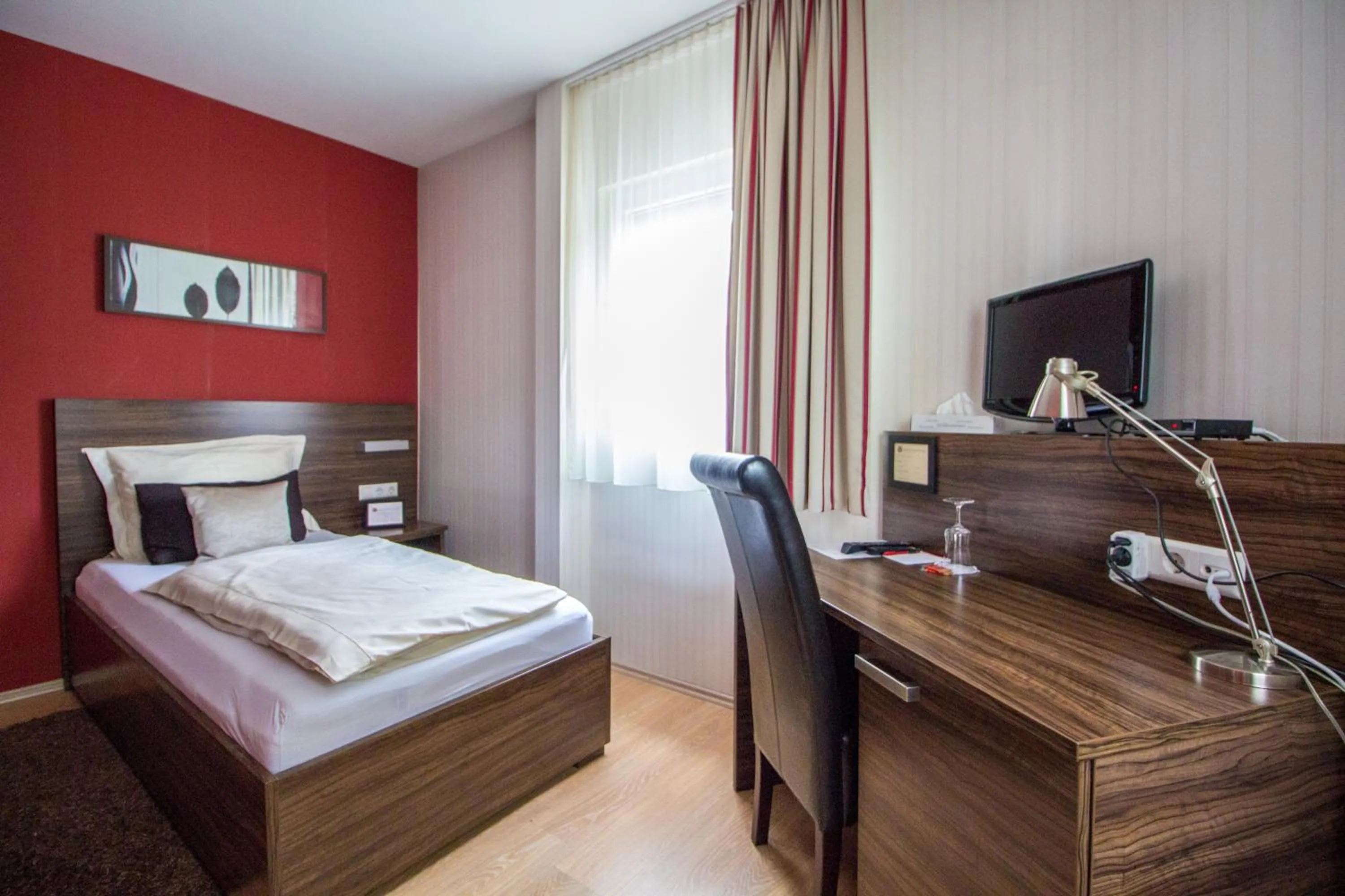 Photo of the whole room, Bed in Landhotel Wolfschlugen