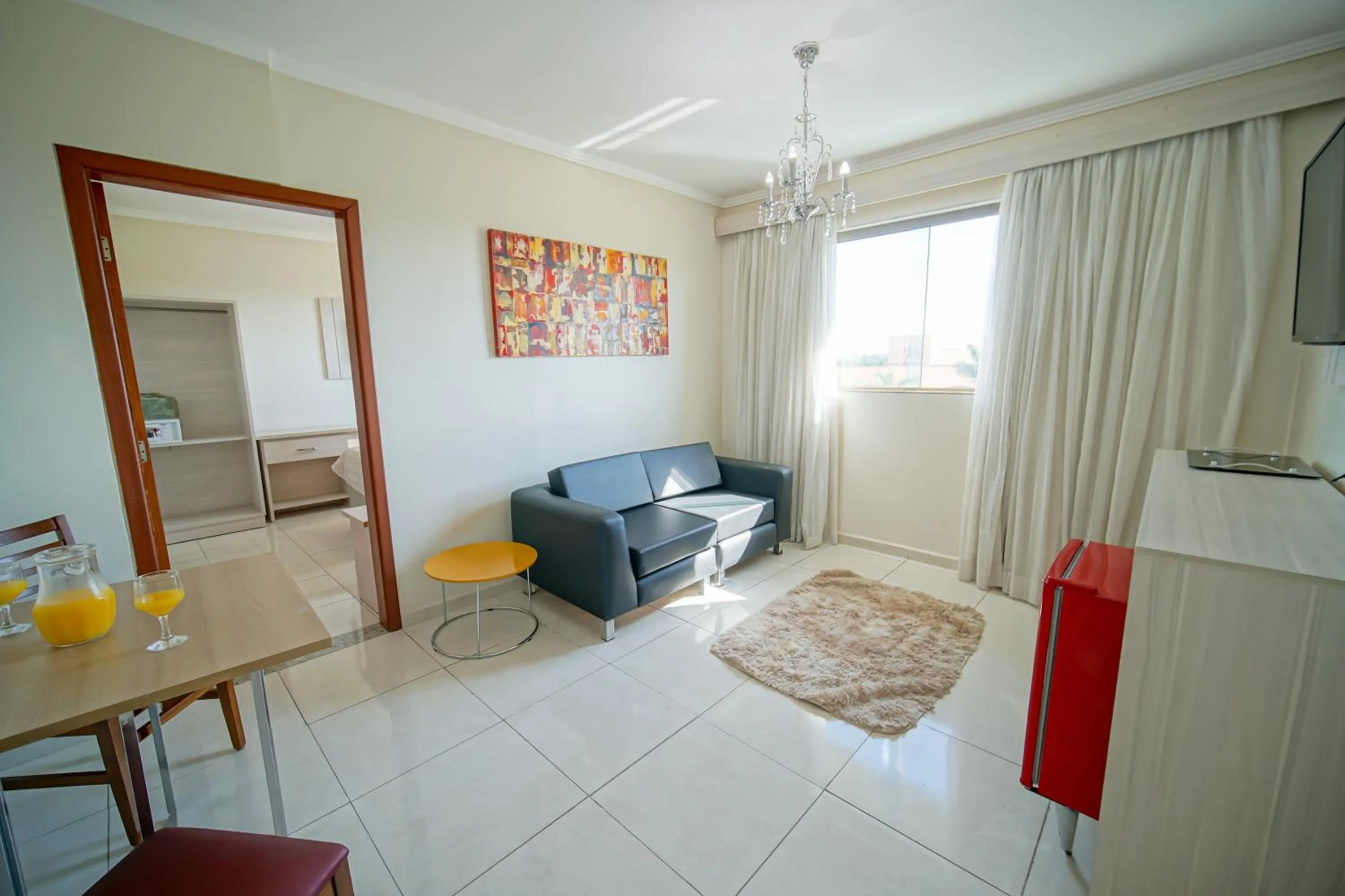 Communal lounge/ TV room in Hotel Golden Park Sorocaba & Convenções by Nacional Inn