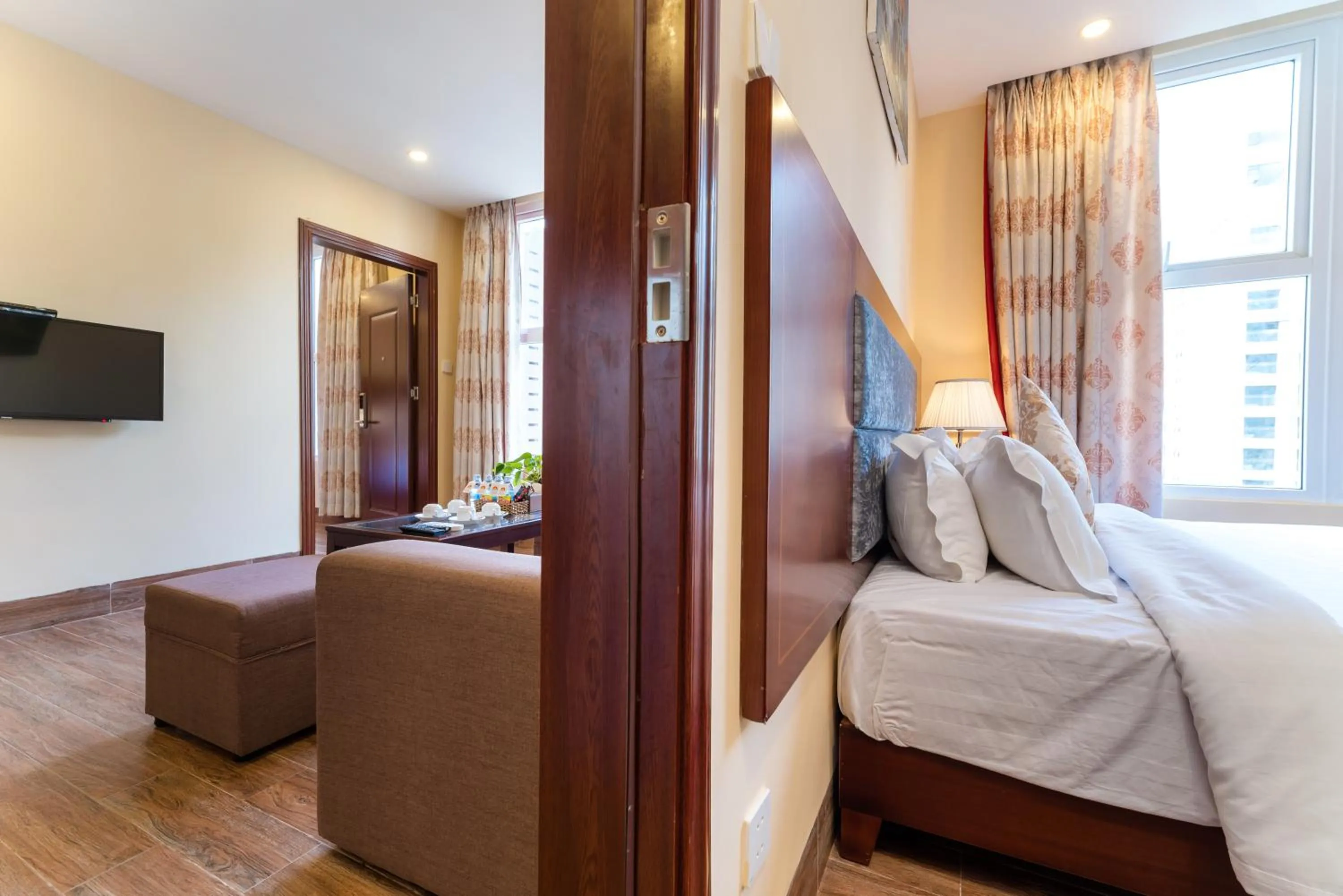 Living room, Bed in Nhat Minh Hotel and Apartment