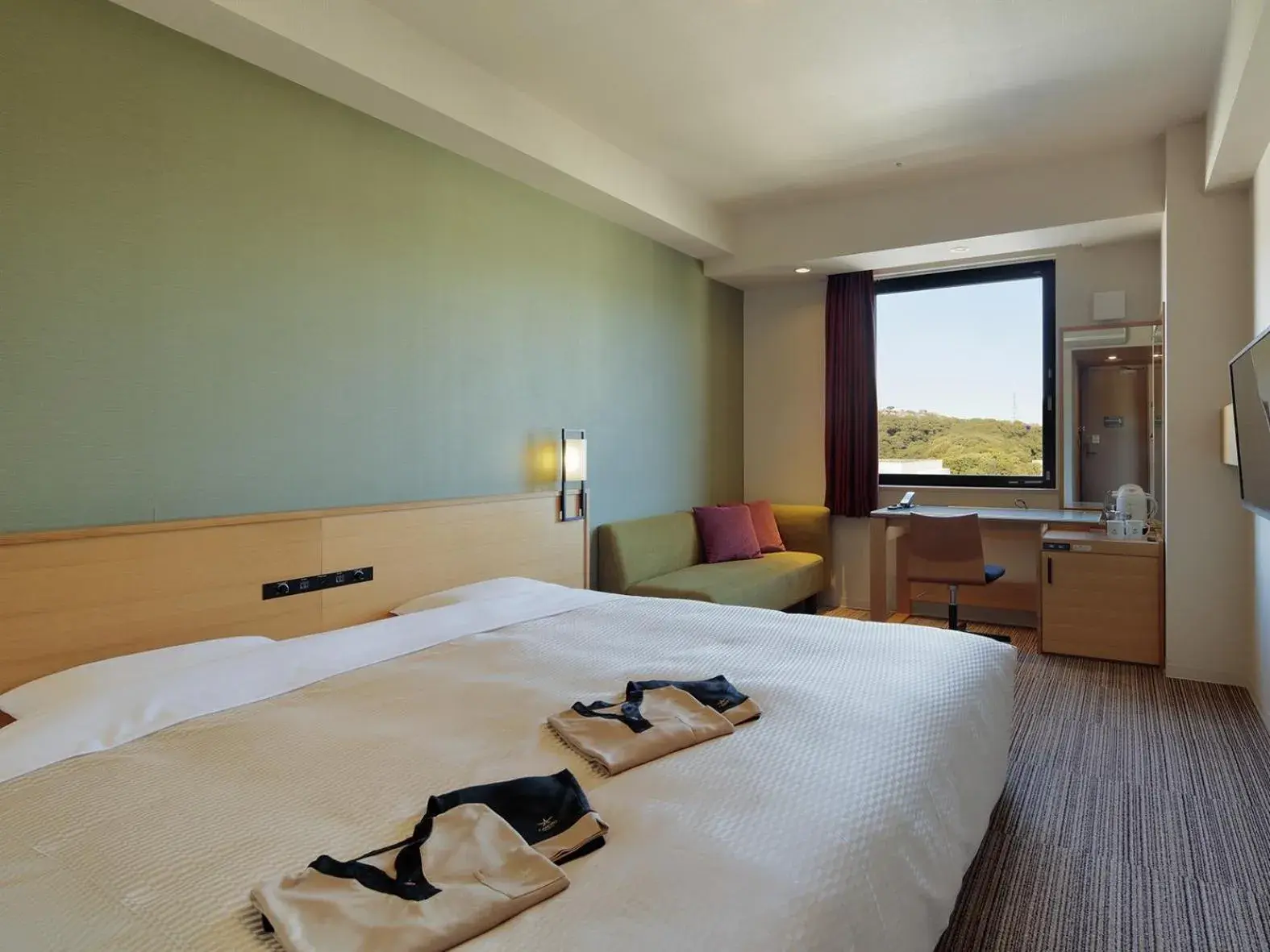 Bed in Candeo Hotels Matsuyama Okaido Bed in Candeo Hotels Matsuyama Okaido