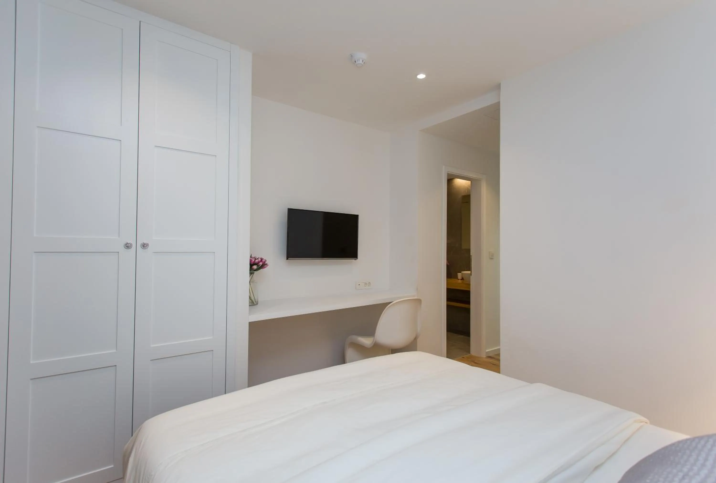 Bed in Bifora Heritage Hotel