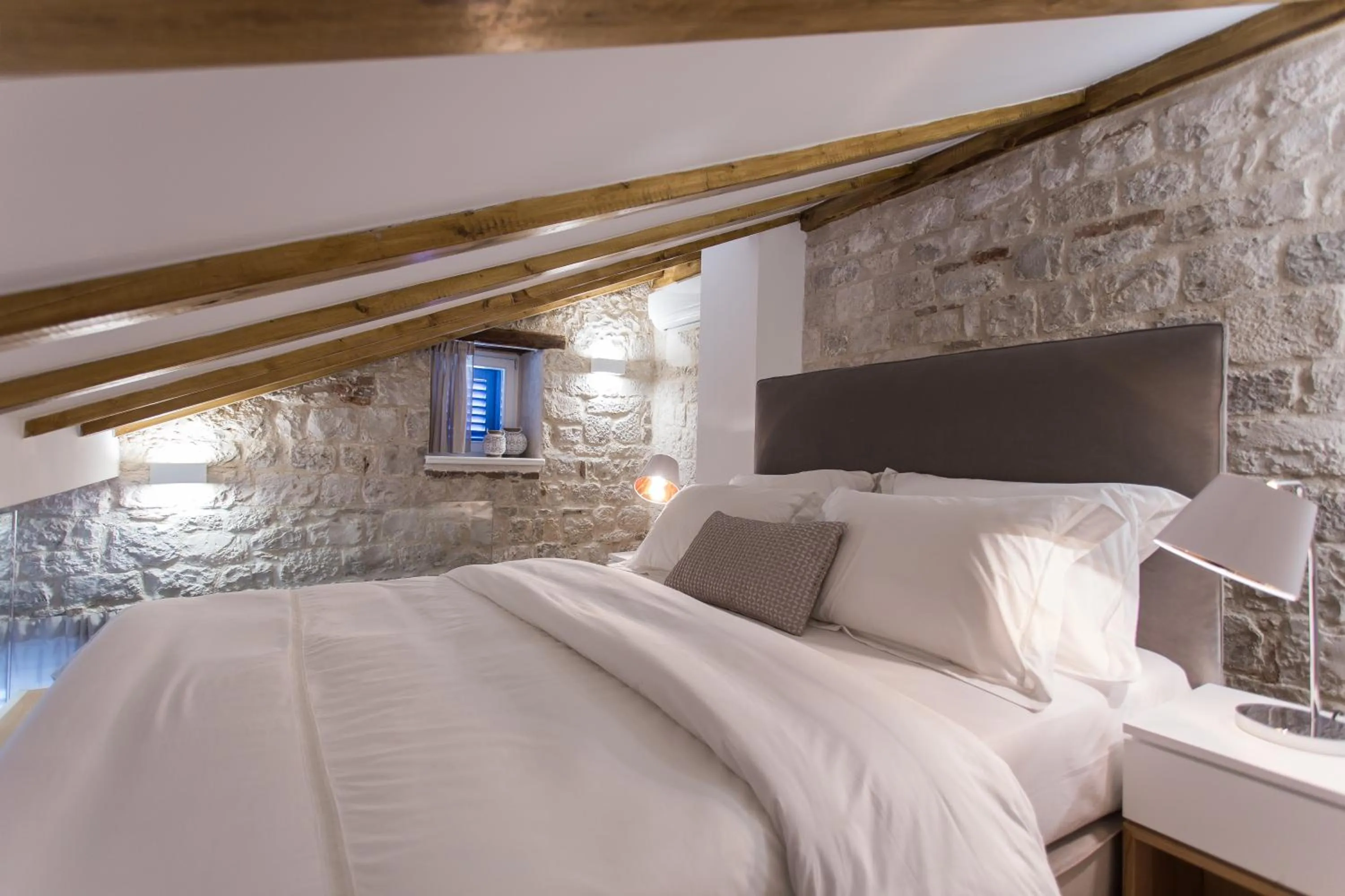 Bed in Bifora Heritage Hotel