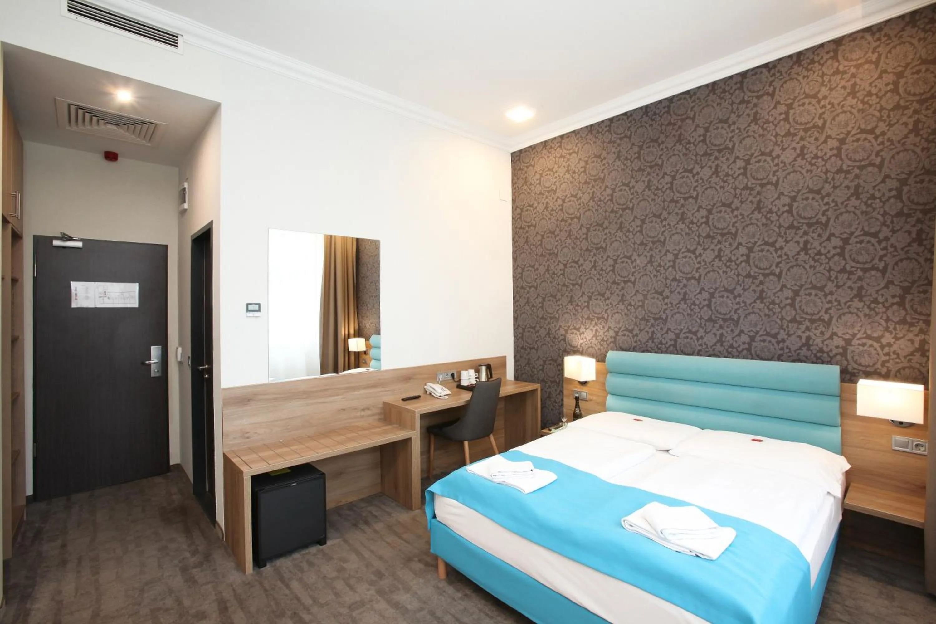 Seating area, Bed in Medos Hotel