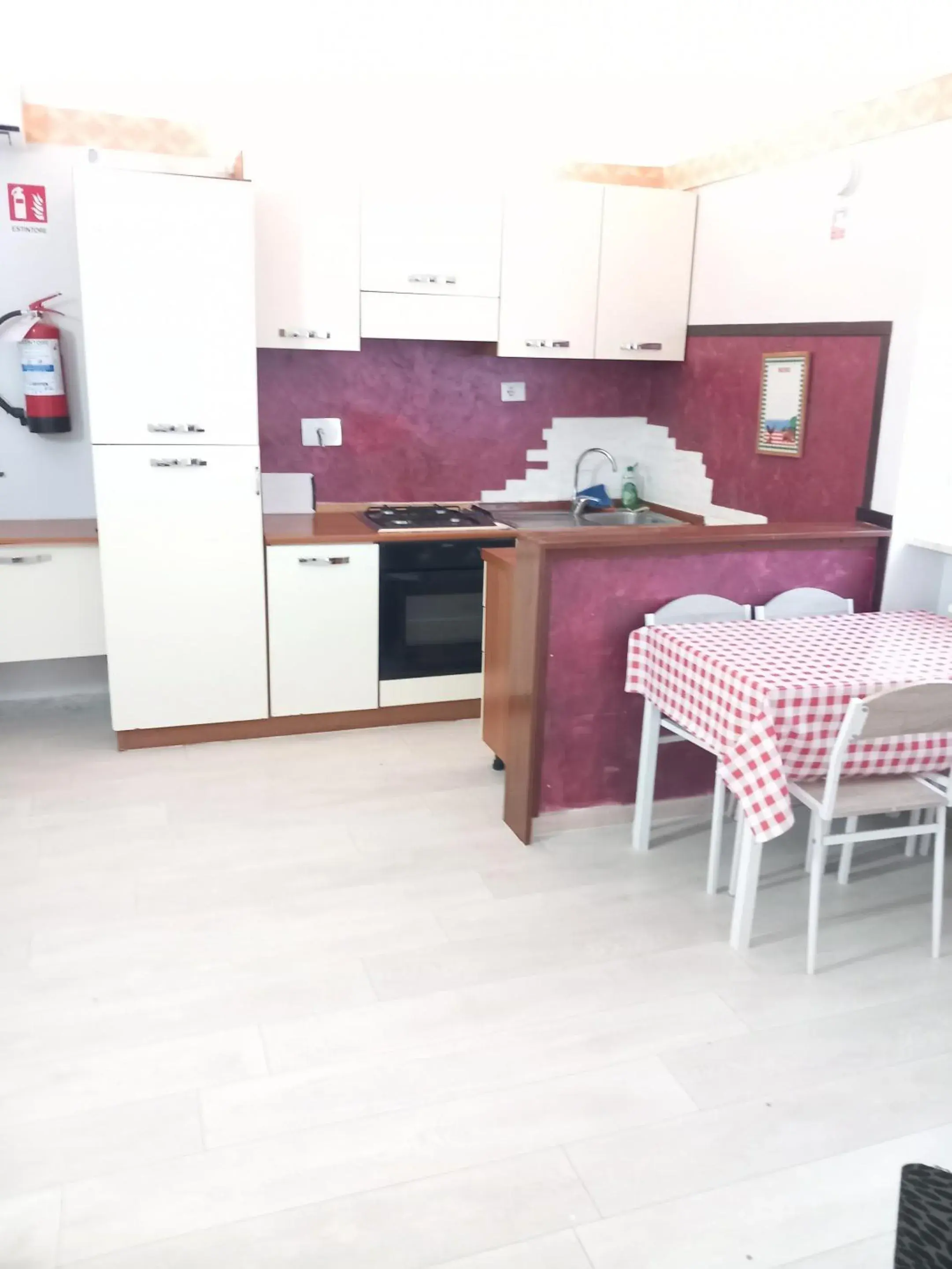 Kitchen or kitchenette in A casa tua Ostia Antica Kitchen or kitchenette in A casa tua Ostia Antica