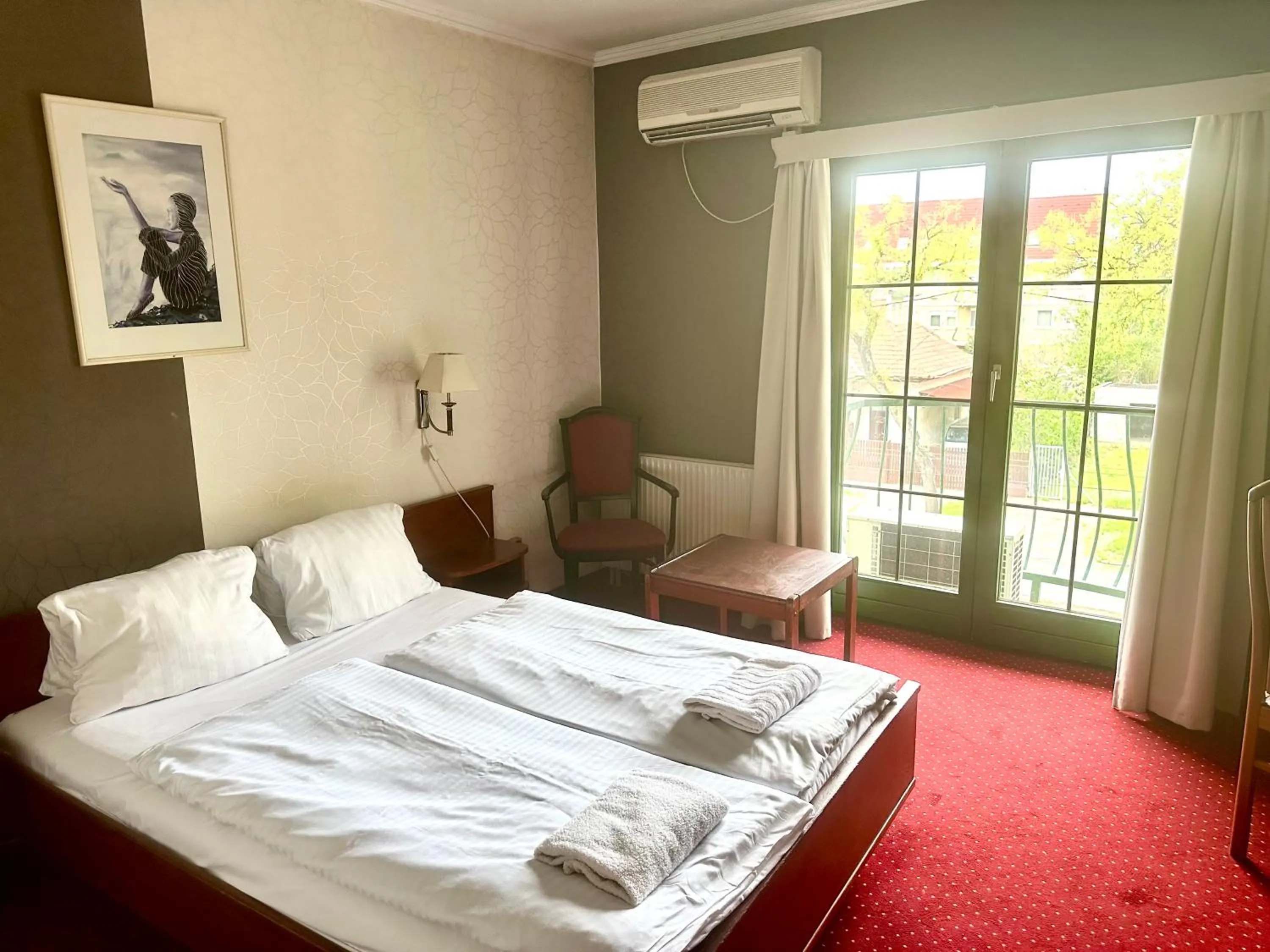 Bed in Hotel Amadeus